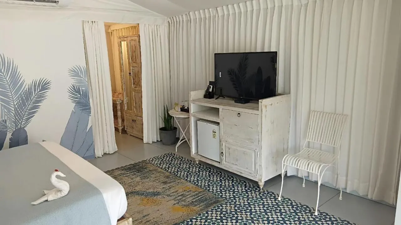 TV and multimedia in The Fern Seaside Luxurious Tent Resort Daman