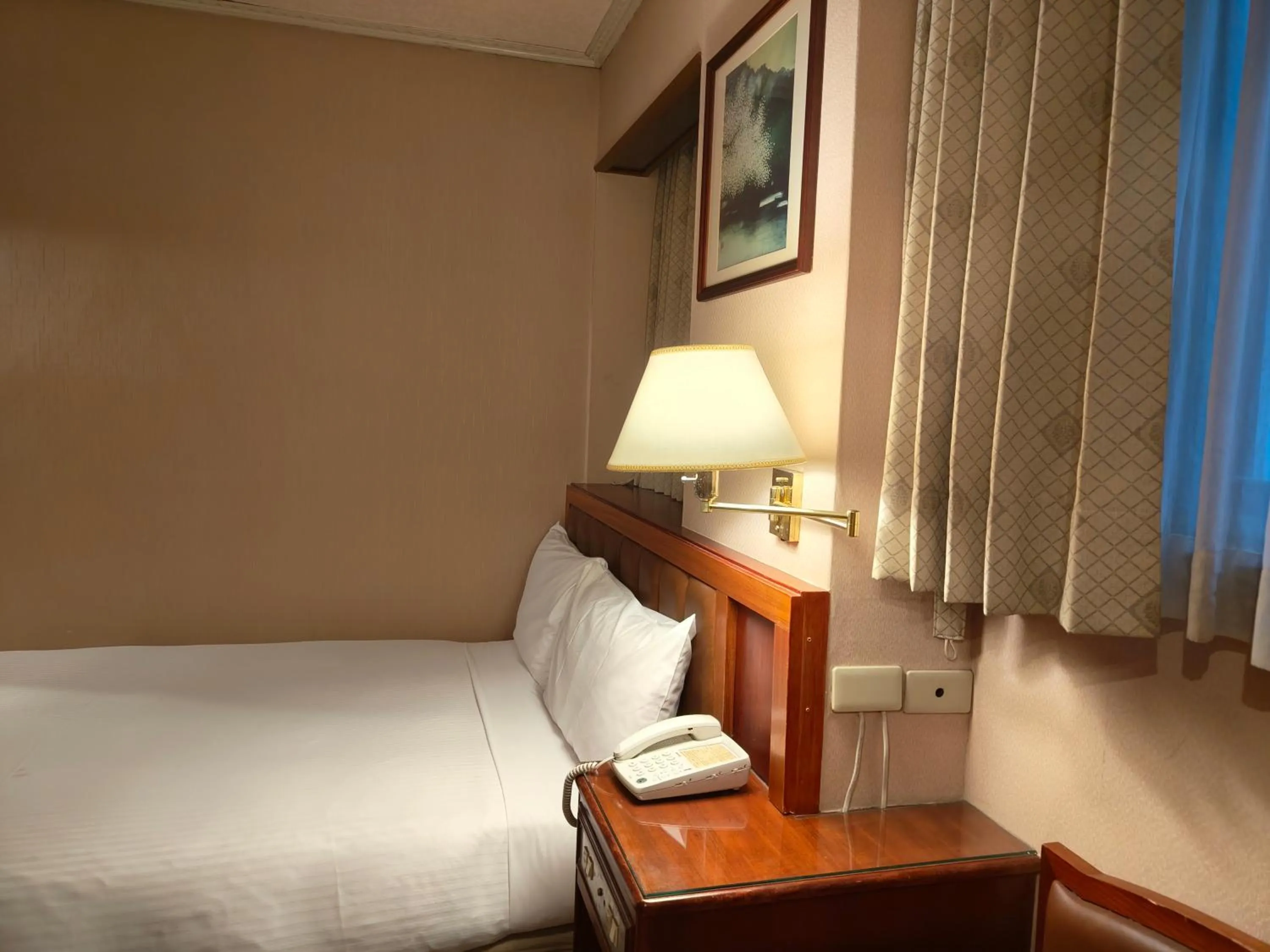 Photo of the whole room, Bed in First Hotel