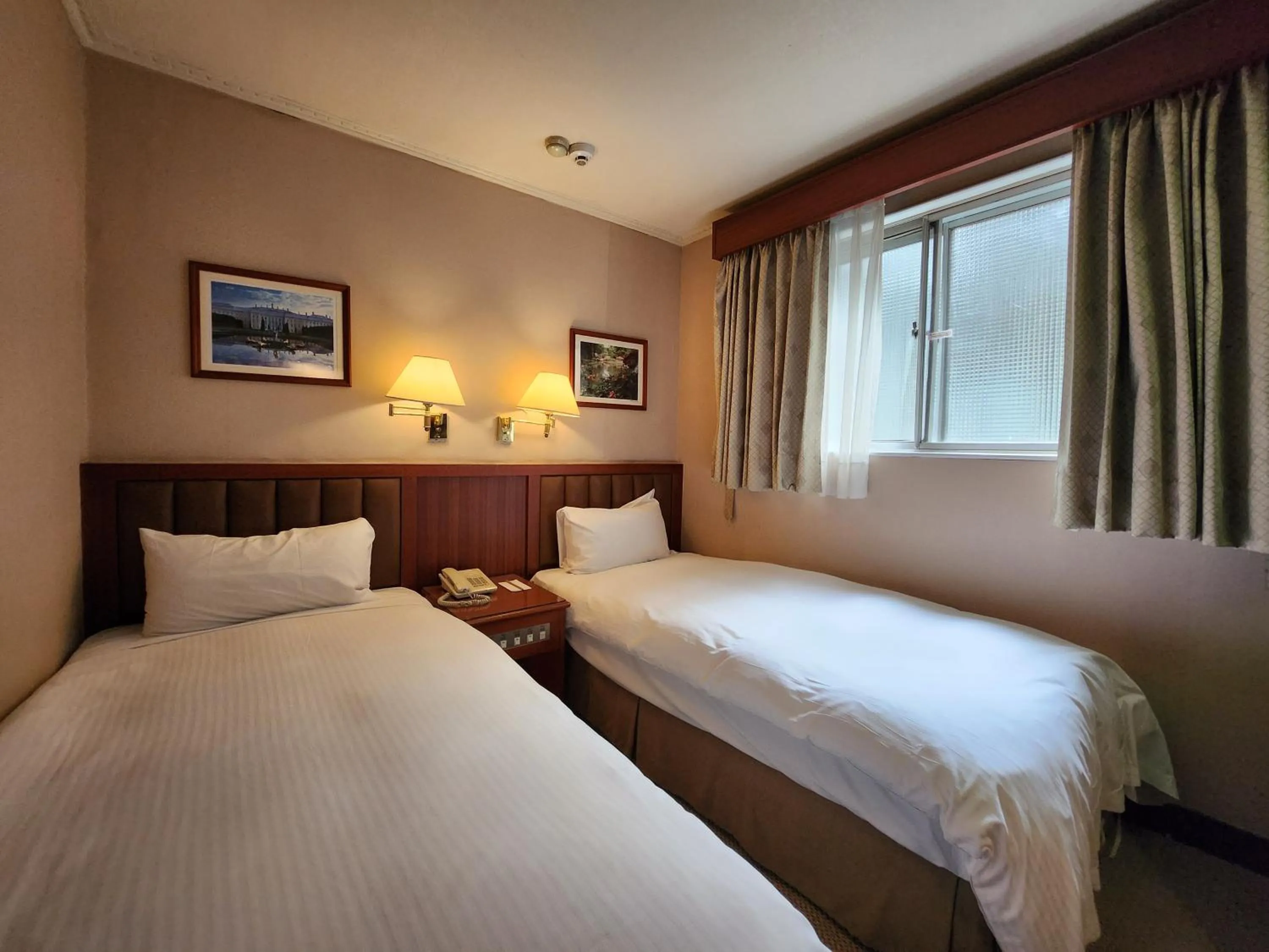 Photo of the whole room, Bed in First Hotel