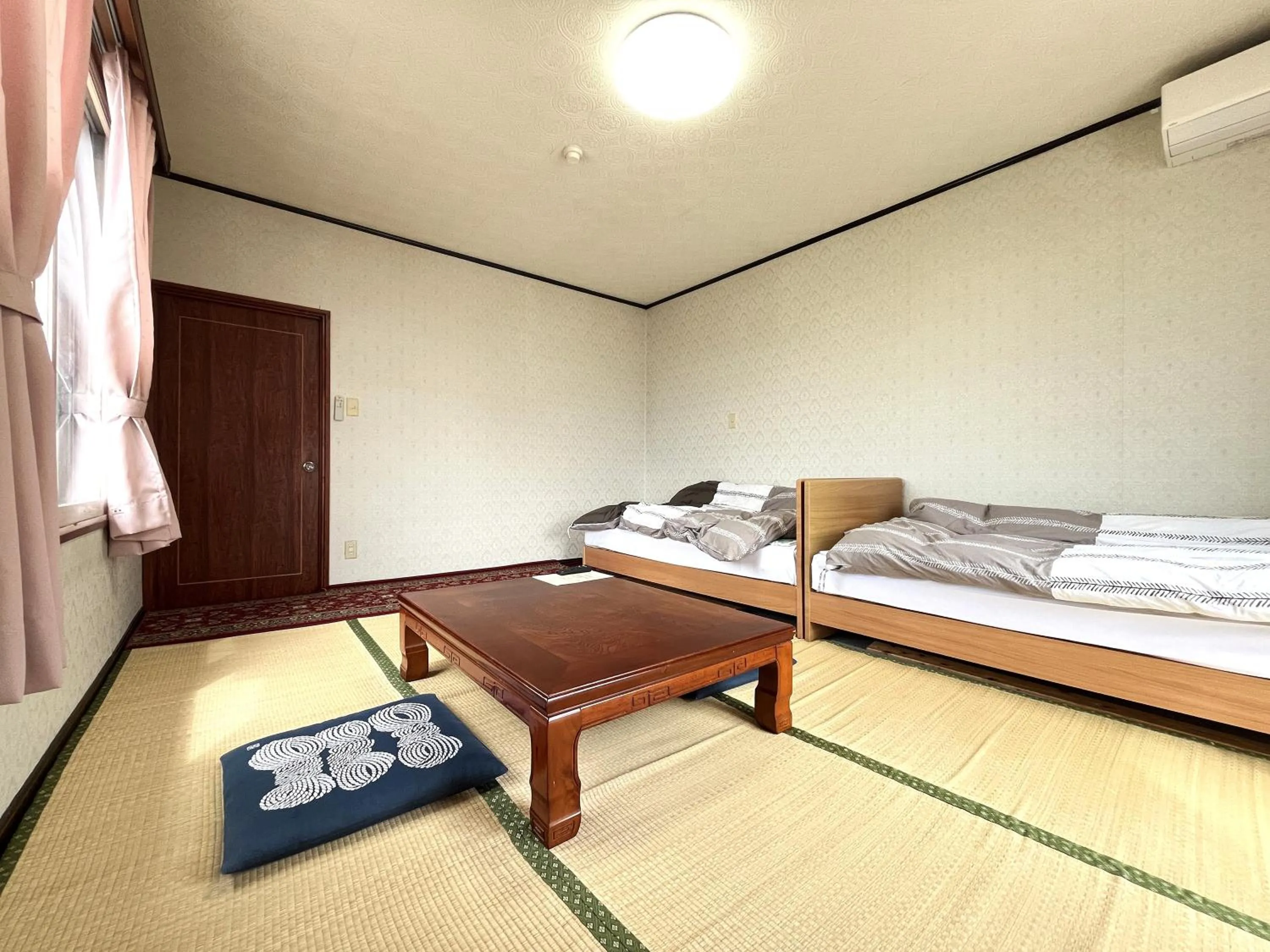Photo of the whole room, Bed in Sunrise Meiji-ya