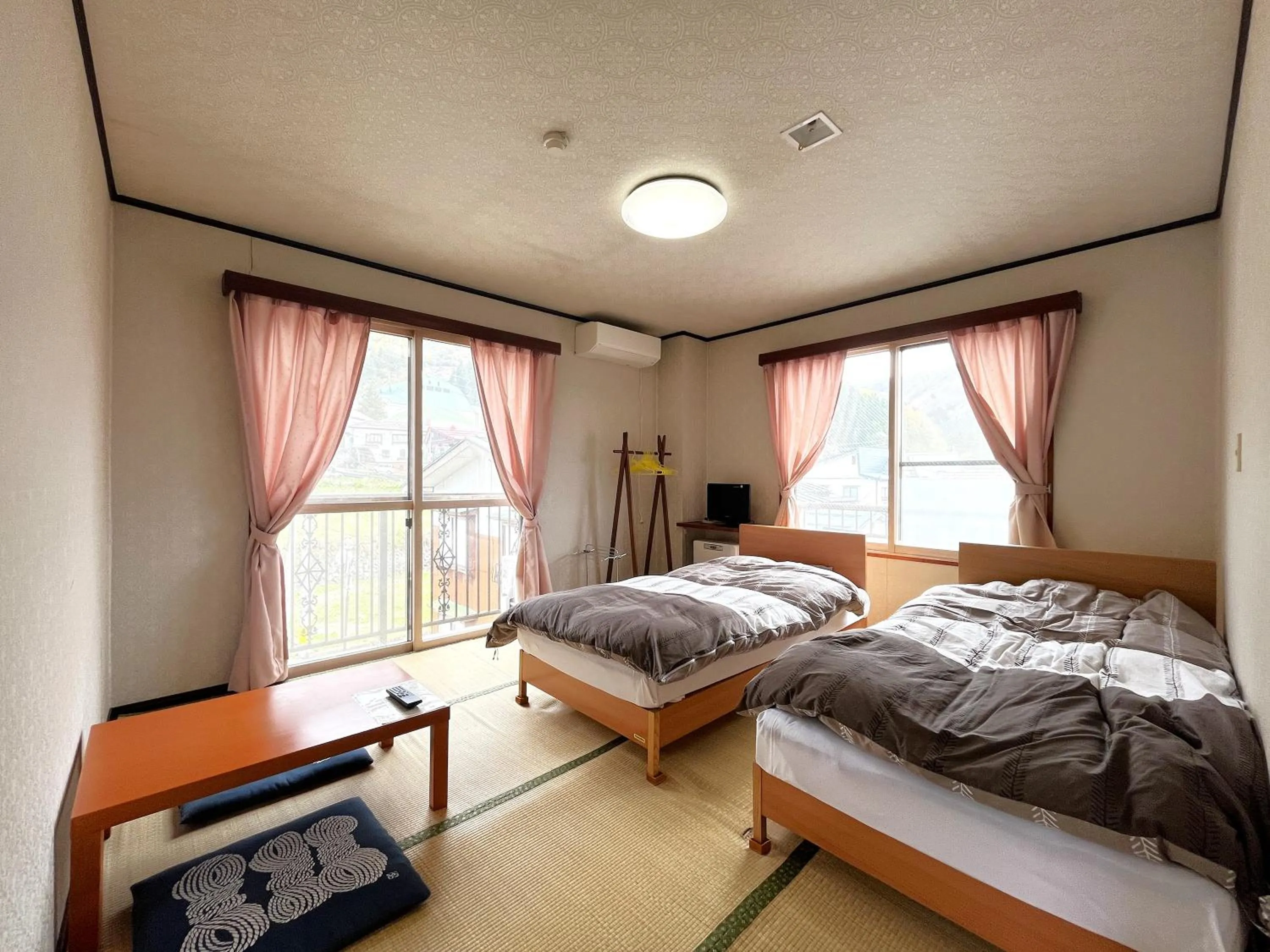 Photo of the whole room, Bed in Sunrise Meiji-ya