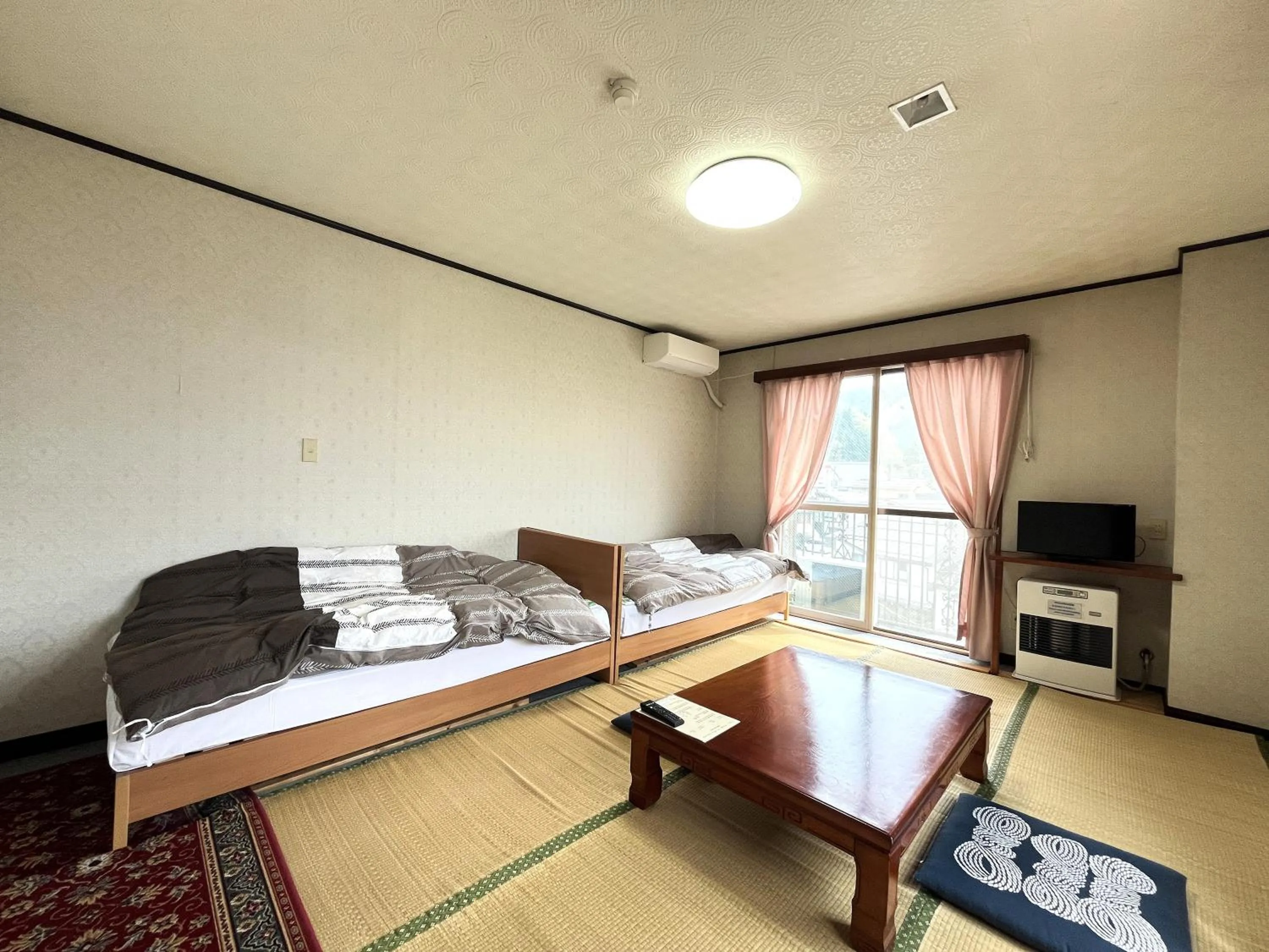 Photo of the whole room, Bed in Sunrise Meiji-ya