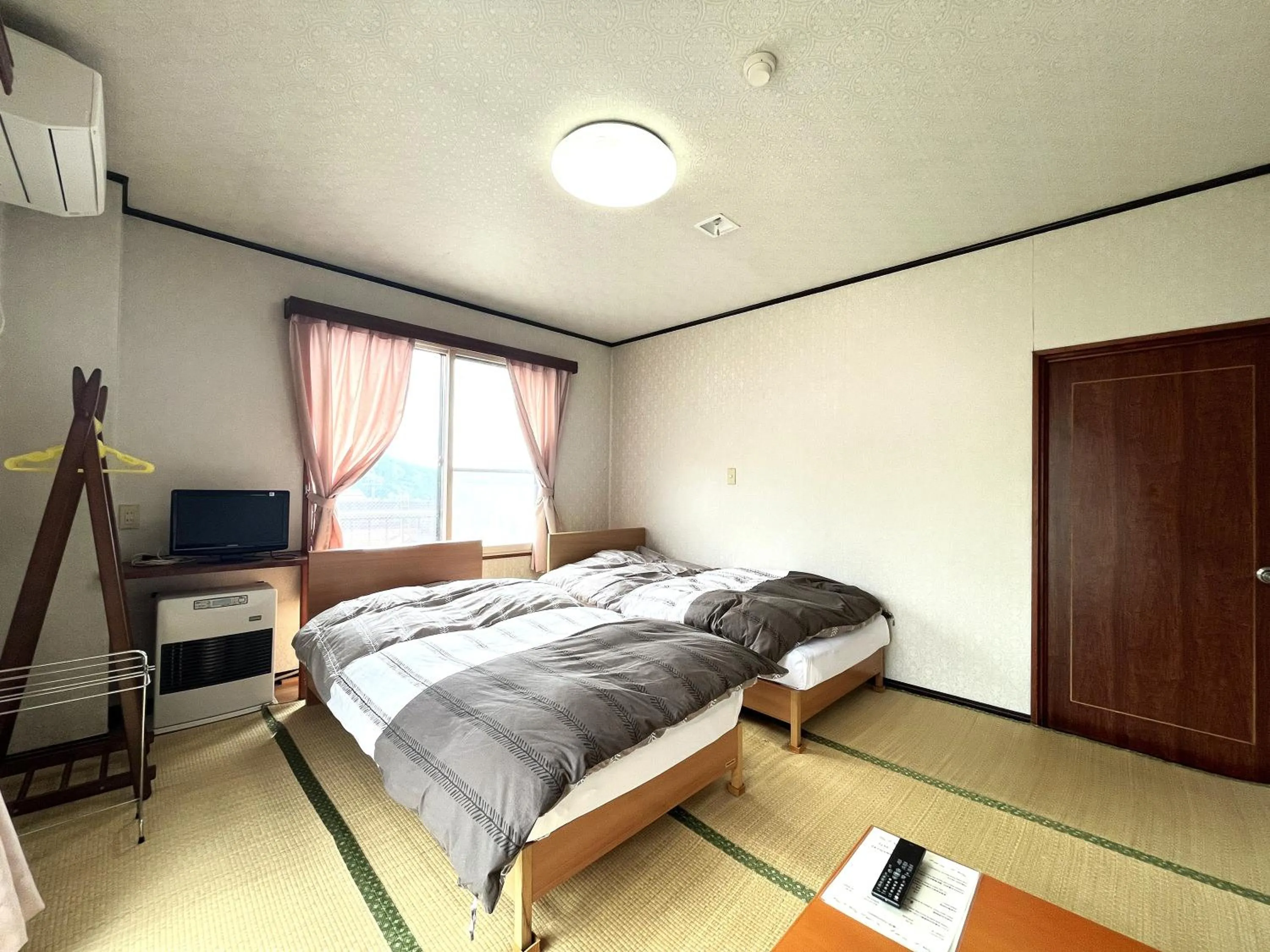 Photo of the whole room, Bed in Sunrise Meiji-ya
