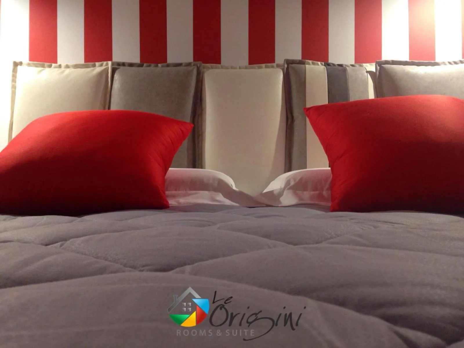 Bed in Le Origini Rooms&Suite