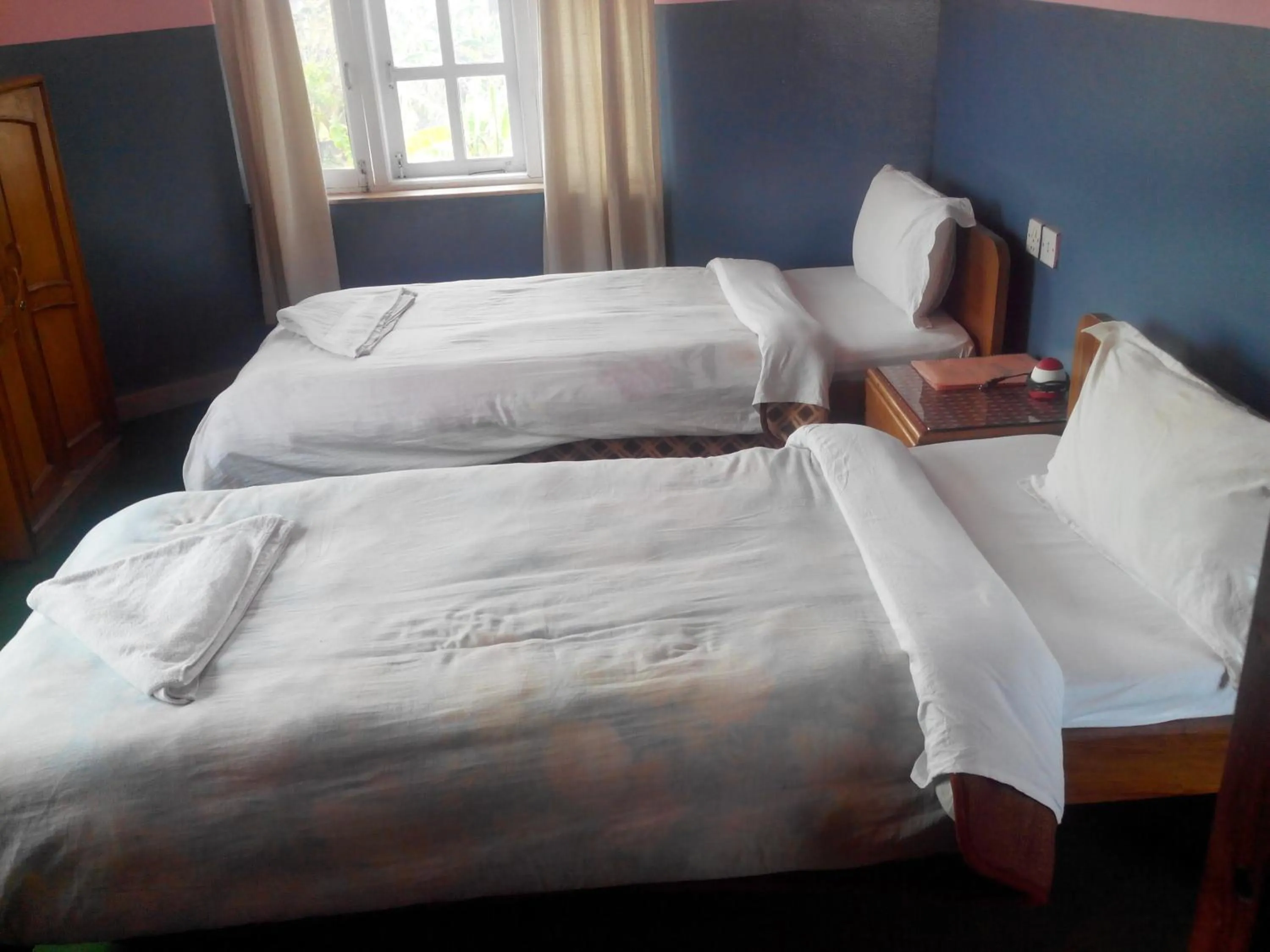 Bed in Hotel Fishtail Villa