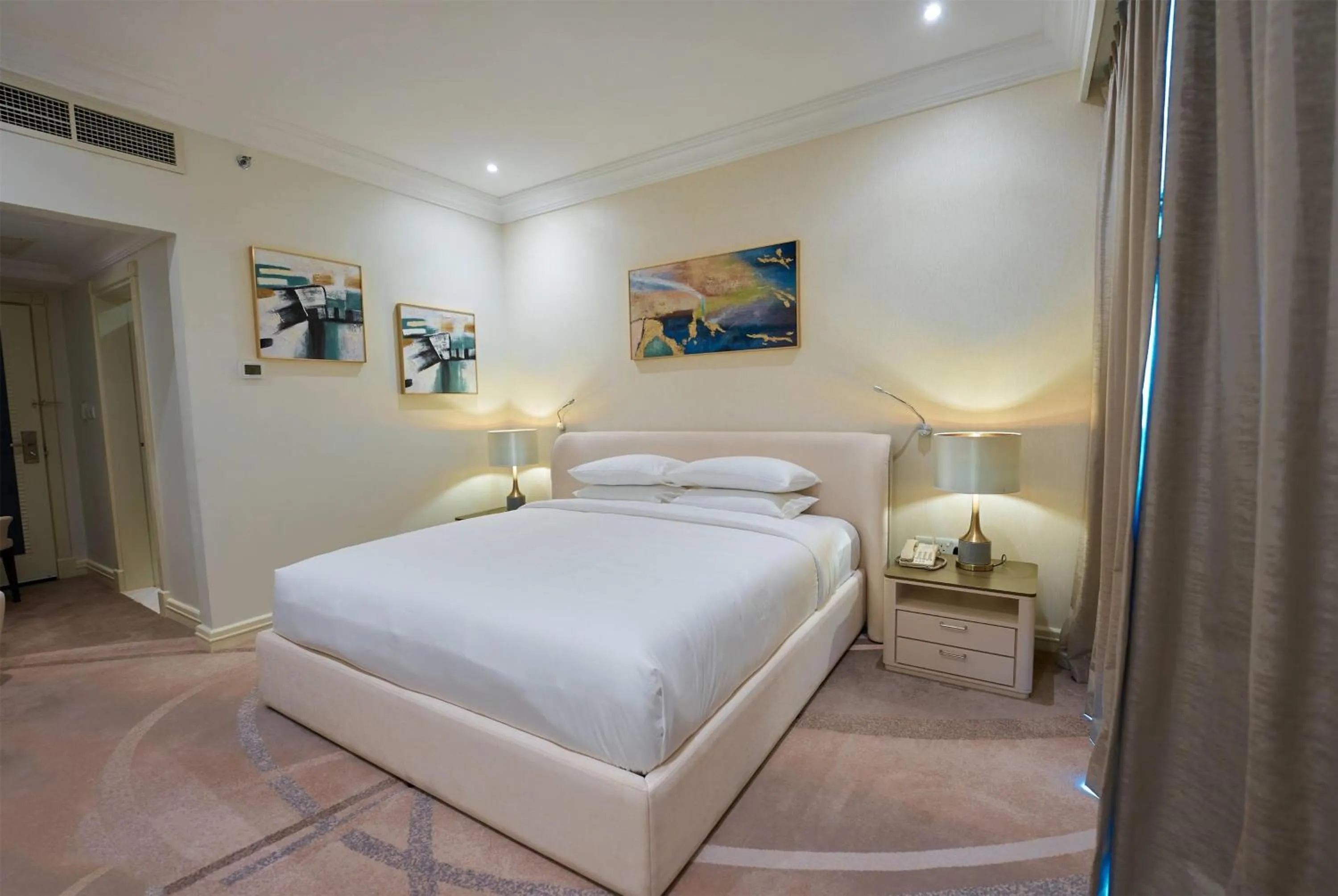 Photo of the whole room, Bed in Grand Regency Doha, Trademark Collection by Wyndham