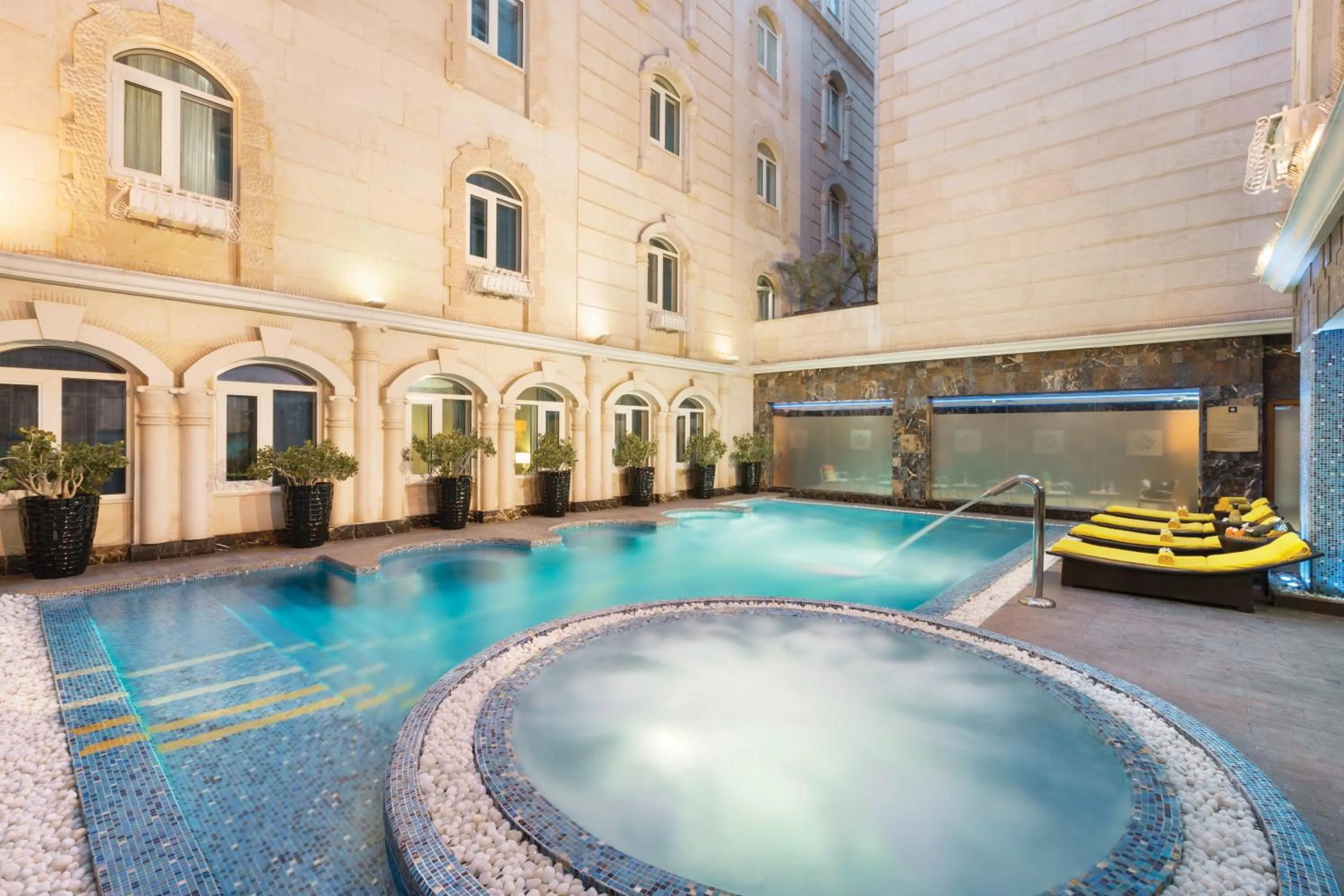Swimming pool in Grand Regency Doha, Trademark Collection by Wyndham