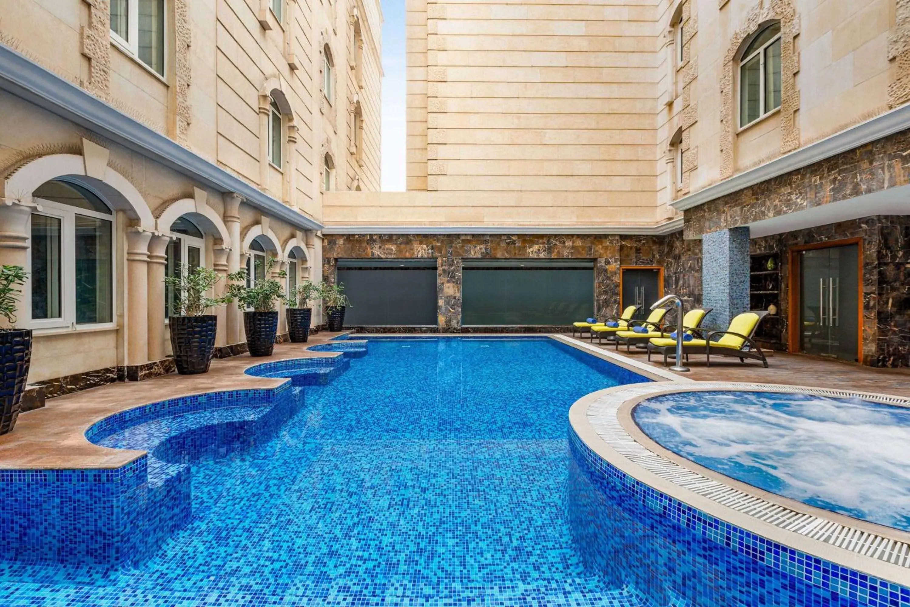 Swimming pool in Grand Regency Doha, Trademark Collection by Wyndham Swimming pool in Grand Regency Doha, Trademark Collection by Wyndham