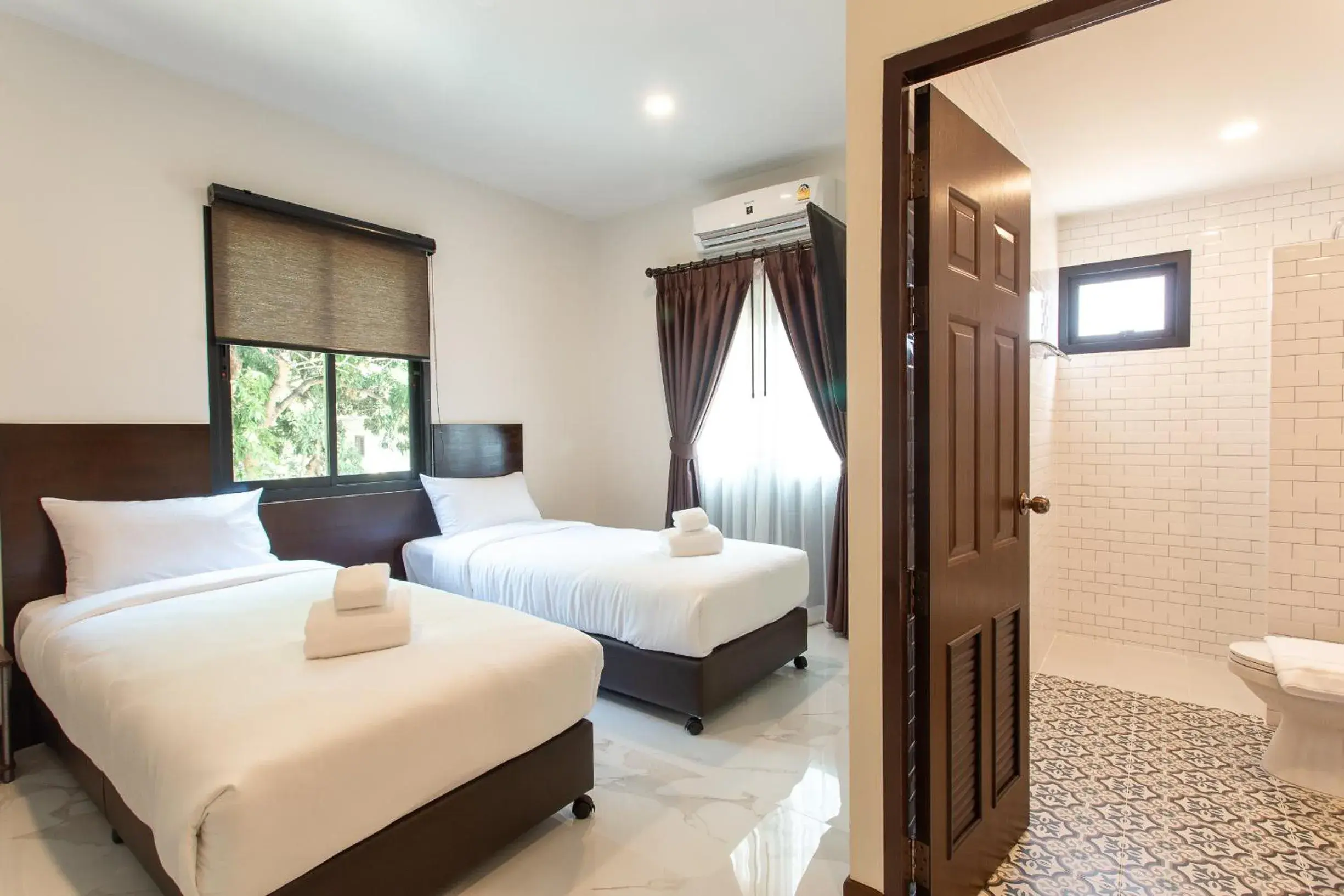 Bed in Khampare Chiang Mai Hotel Bed in Khampare Chiang Mai Hotel