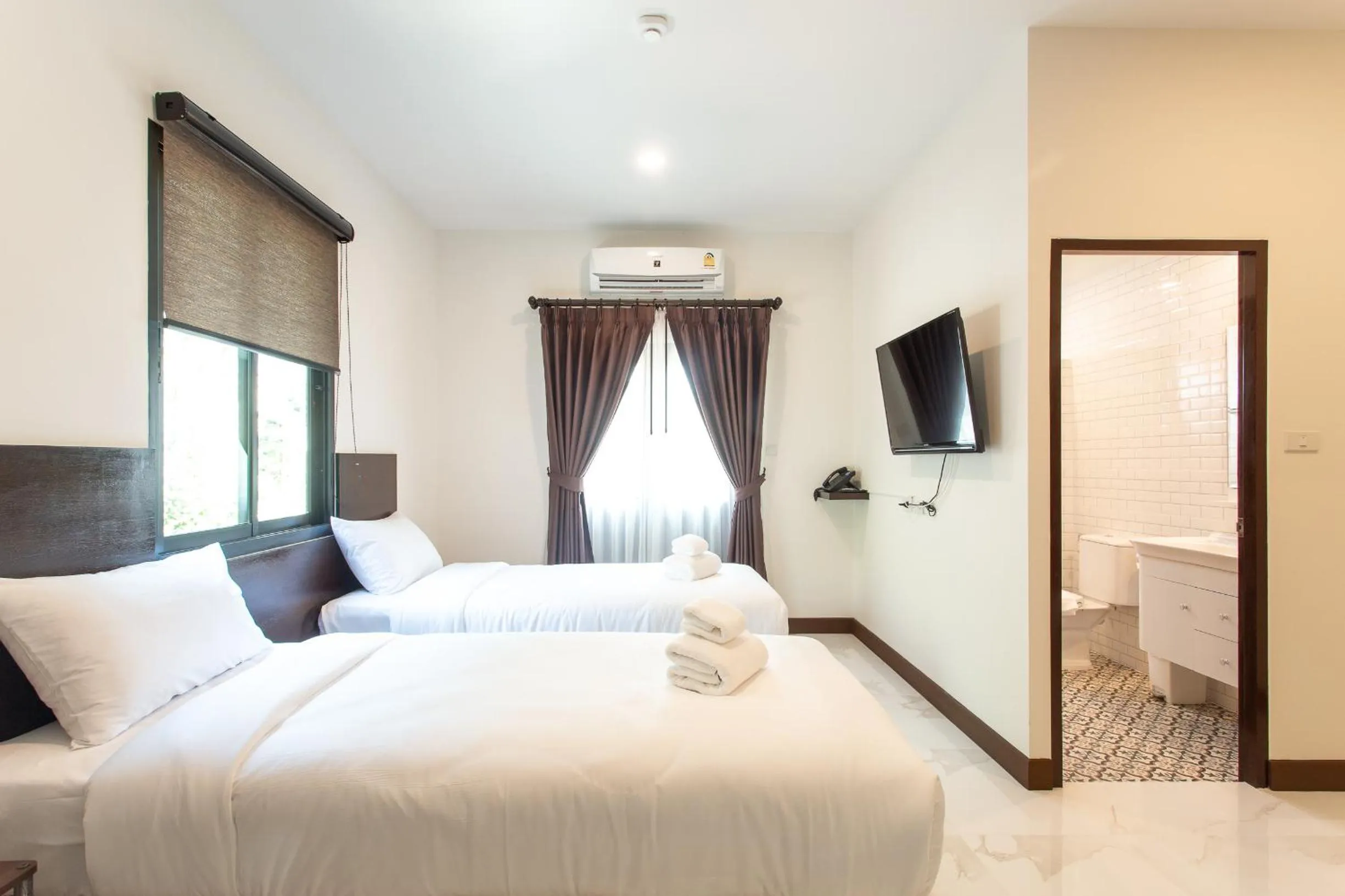 Bed in Khampare Chiang Mai Hotel