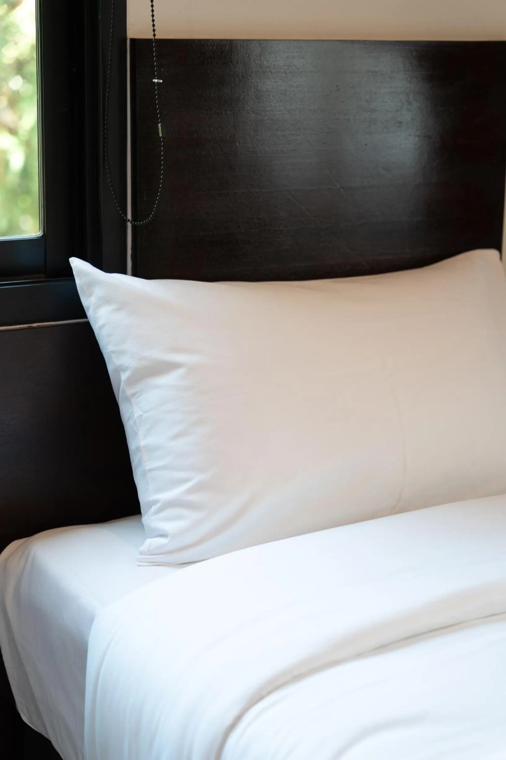 Bed in Khampare Chiang Mai Hotel