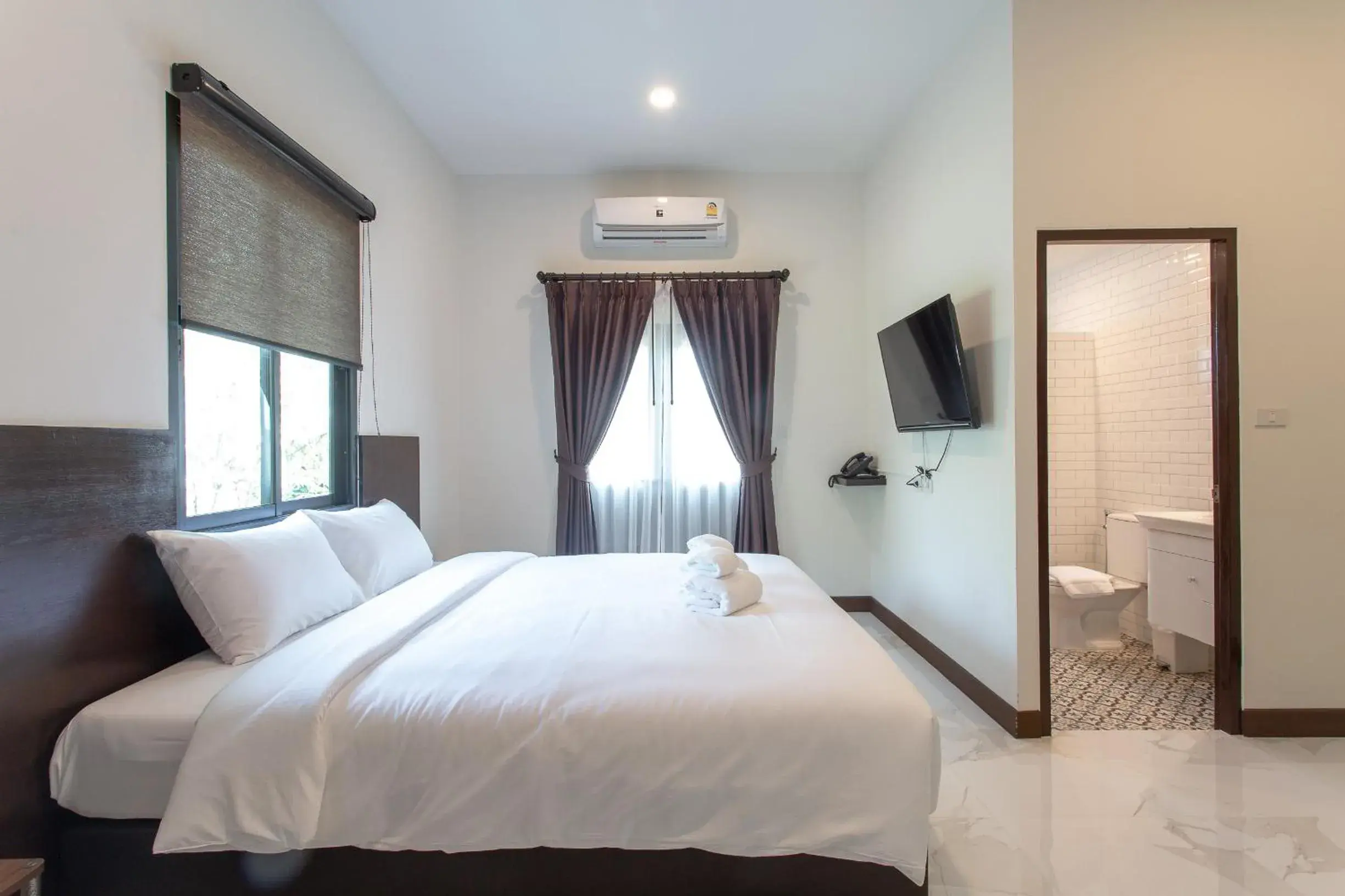 Bed in Khampare Chiang Mai Hotel Bed in Khampare Chiang Mai Hotel