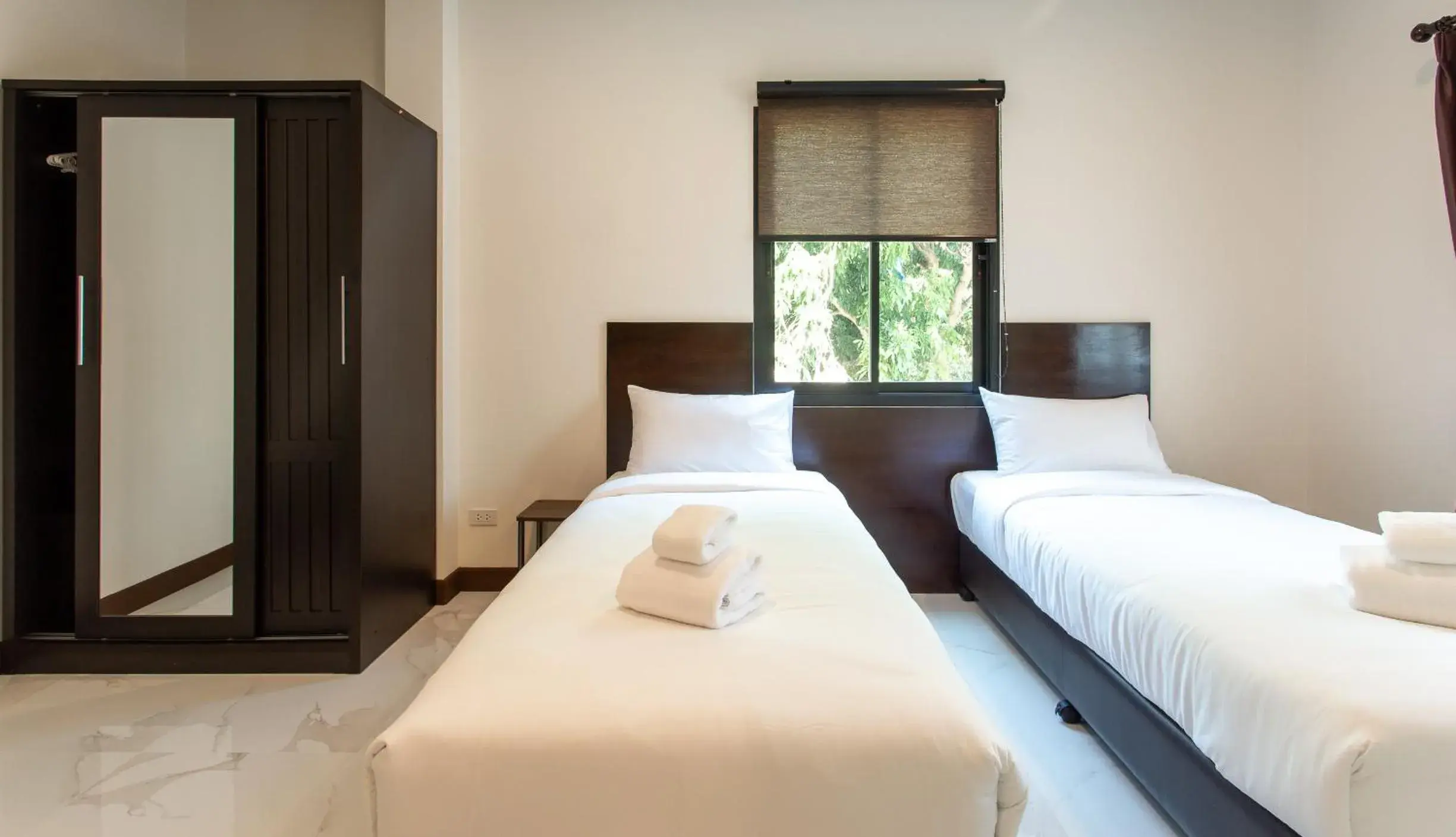 Bed in Khampare Chiang Mai Hotel Bed in Khampare Chiang Mai Hotel