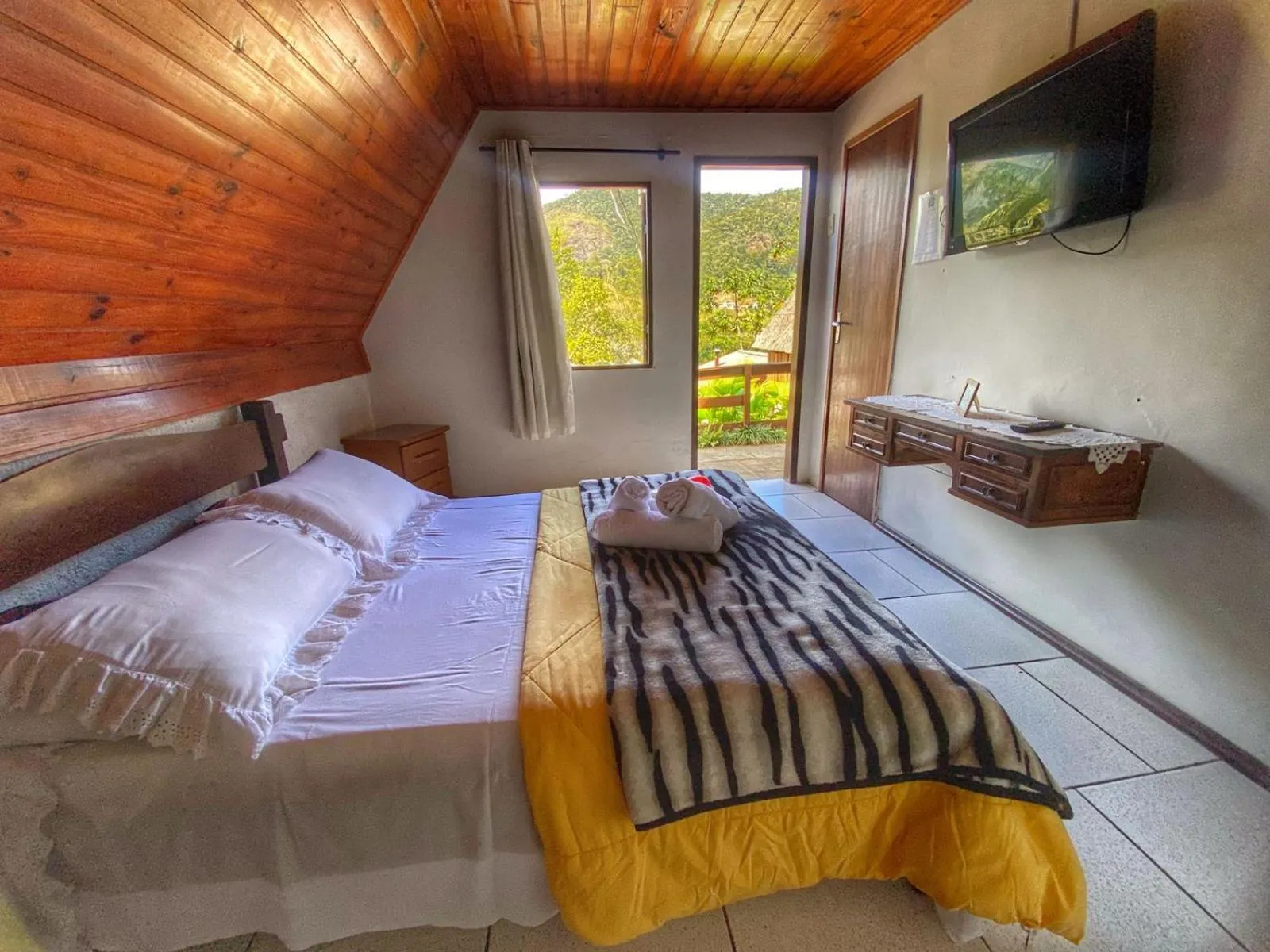 Bed in Pousada Colibri Serrano