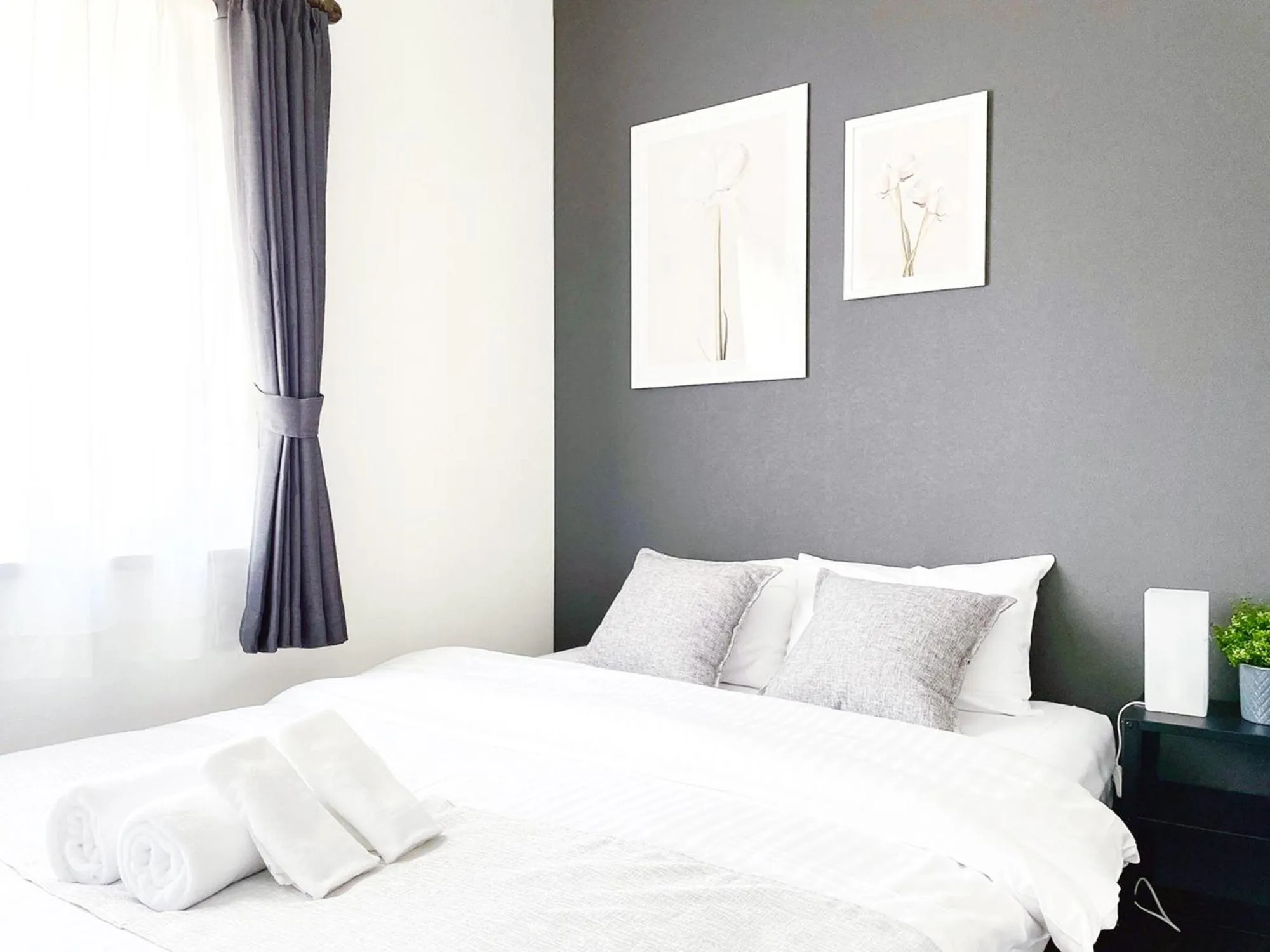 Bed in OUCHI HOTEL SUITE Temma