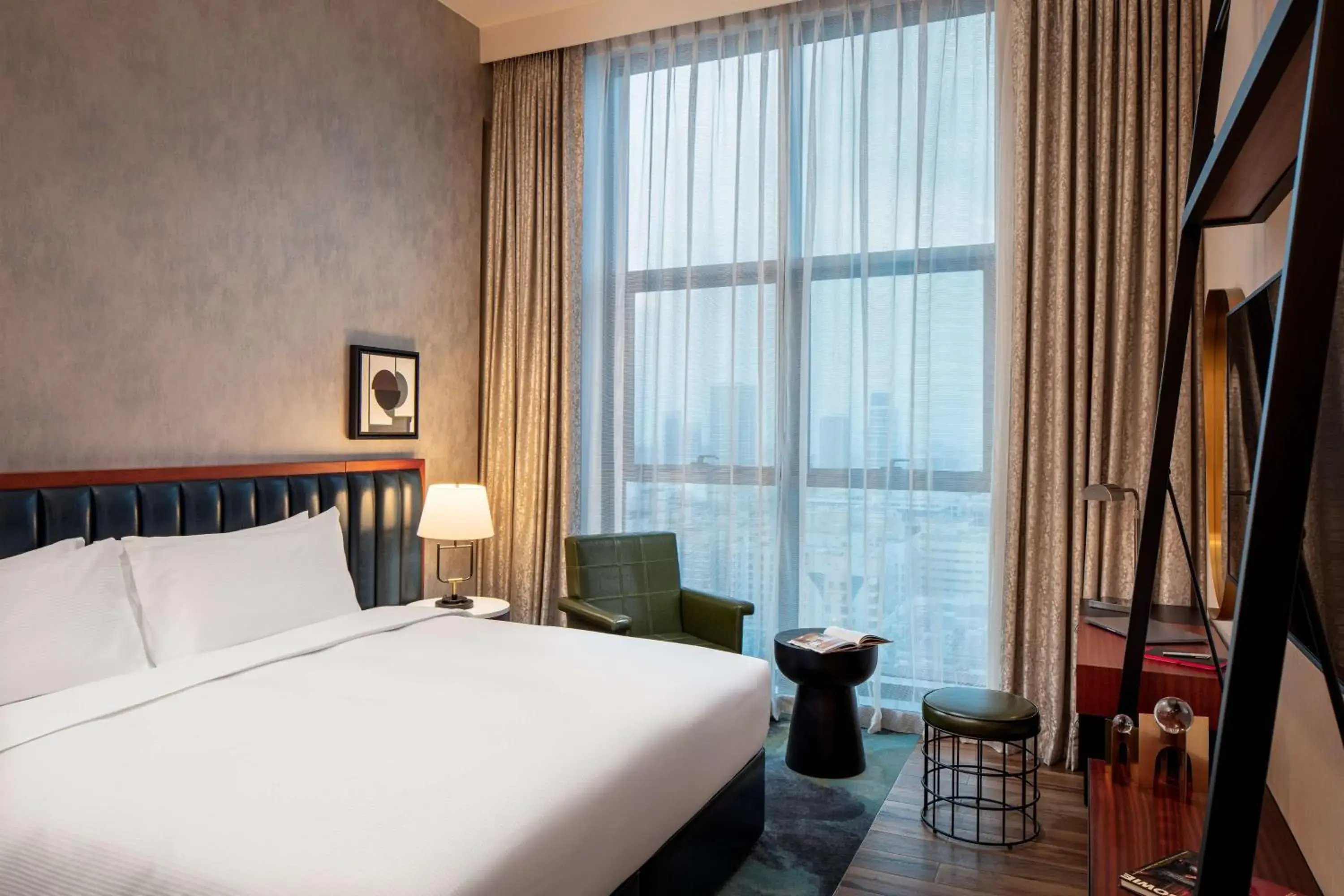 Living room, Bed in DoubleTree by Hilton Dubai M Square Hotel & Residences Living room, Bed in DoubleTree by Hilton Dubai M Square Hotel & Residences