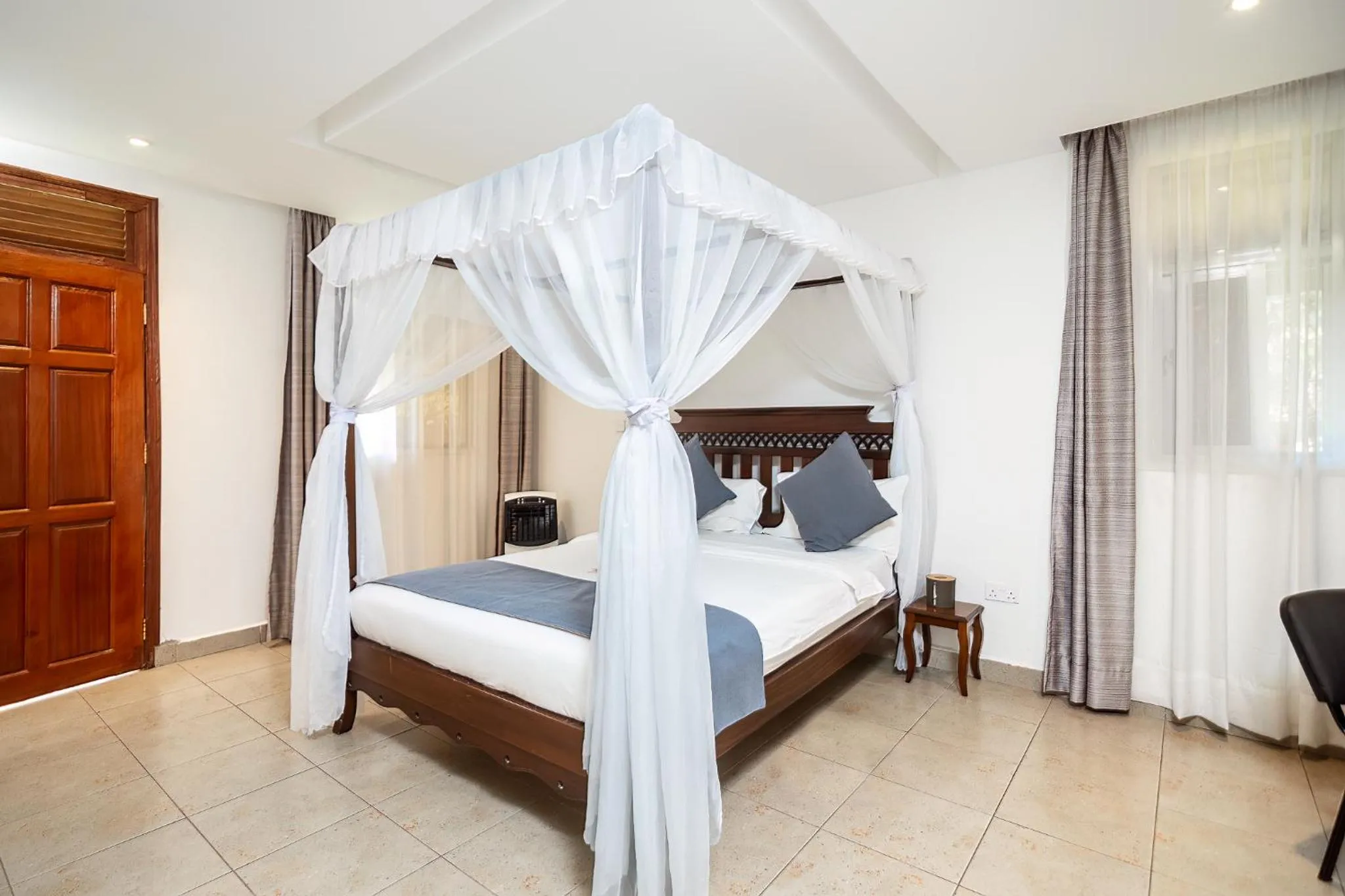 Photo of the whole room, Bed in Harry's Kisumu Oasis
