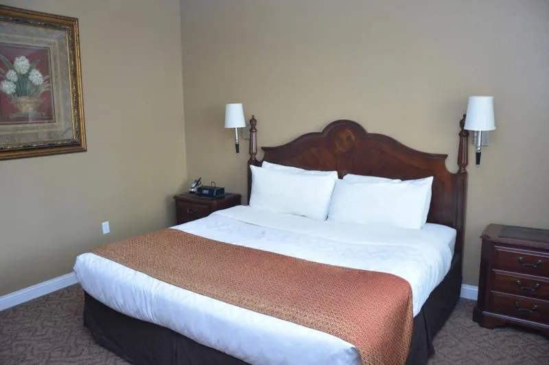 Bed in Roosevelt Inn & Suites