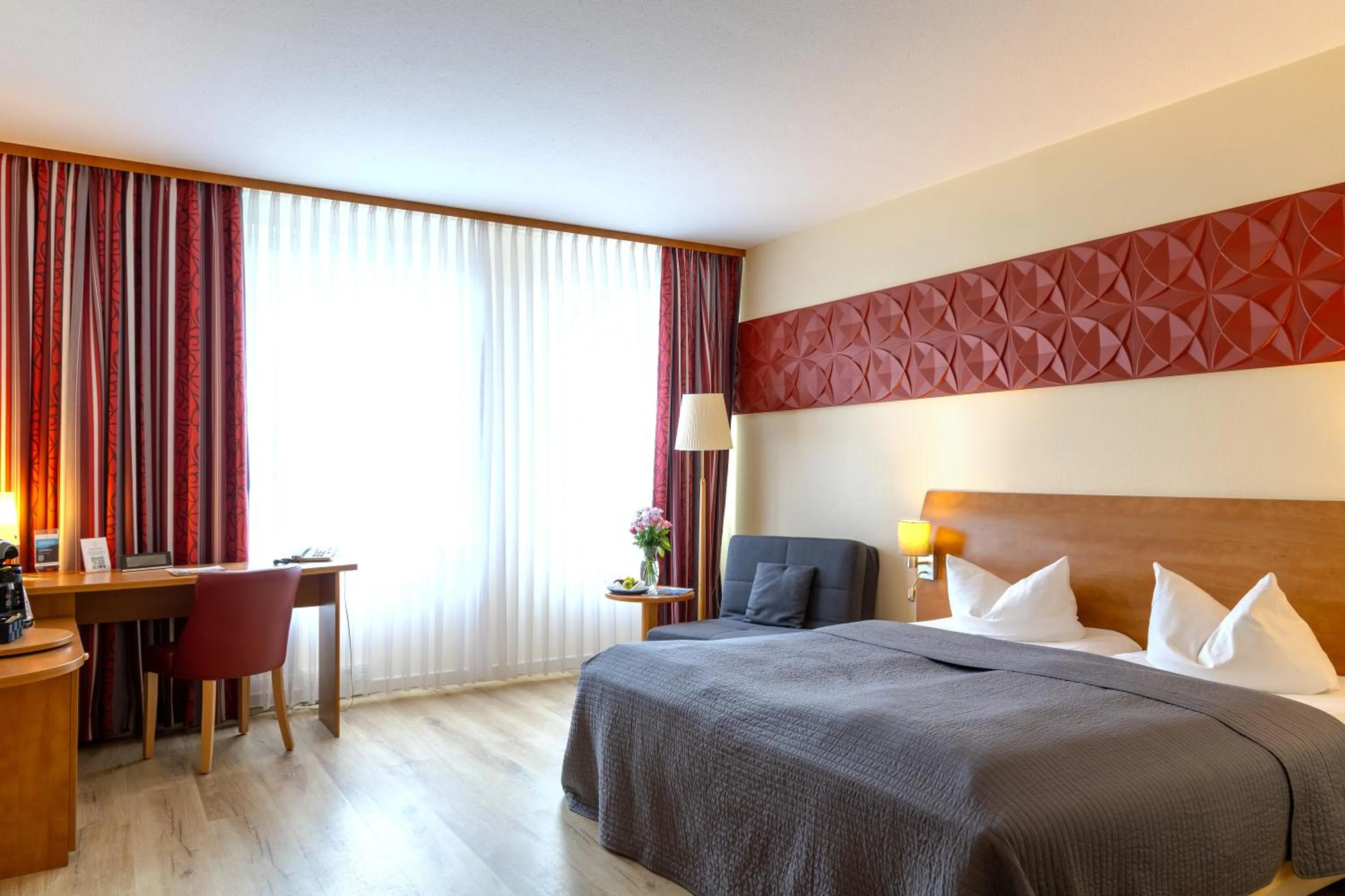 Photo of the whole room, Bed in Hotel Mercator Itzehoe-Klosterforst