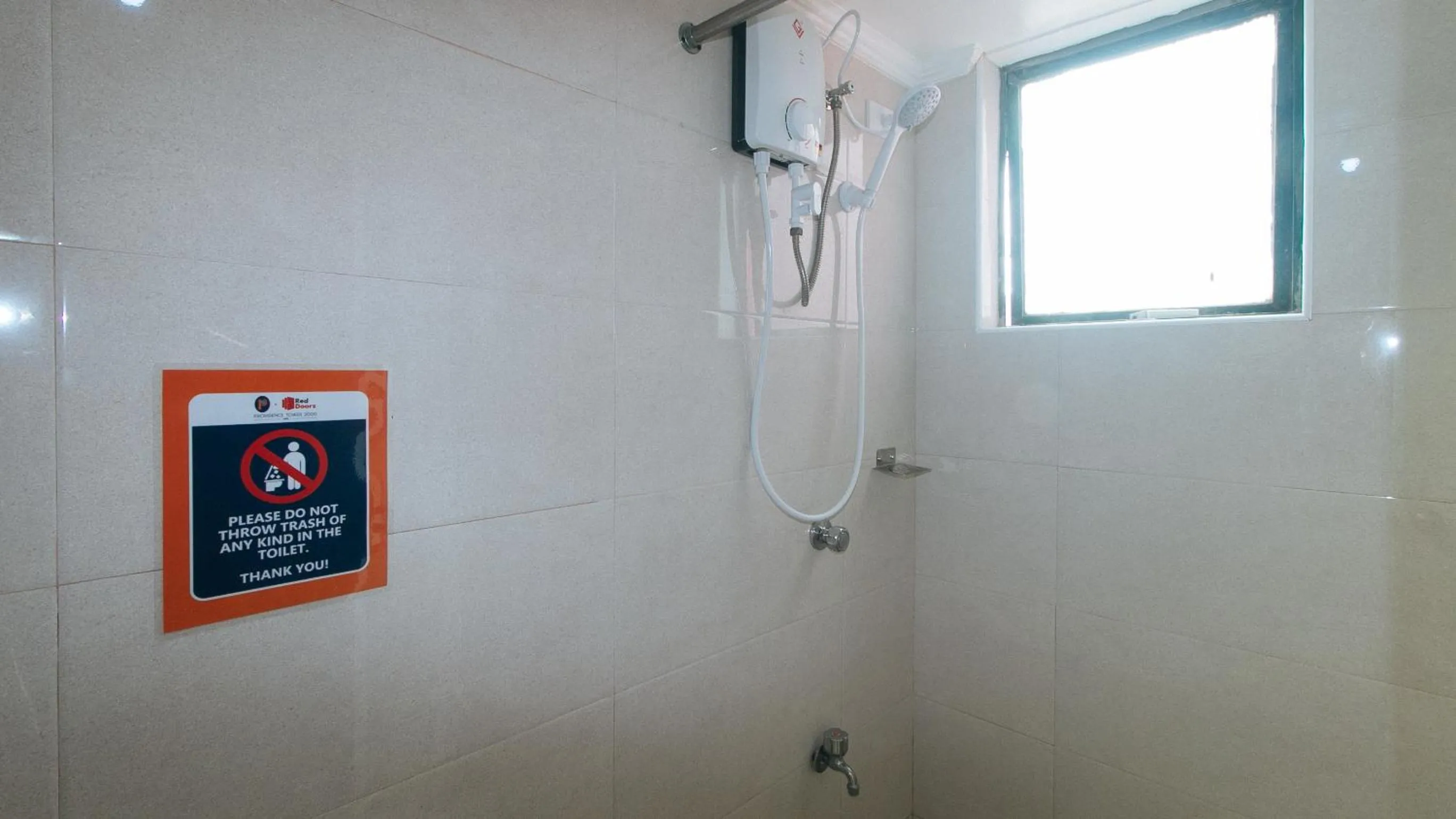 Shower in RedDoorz at The Providence Tower