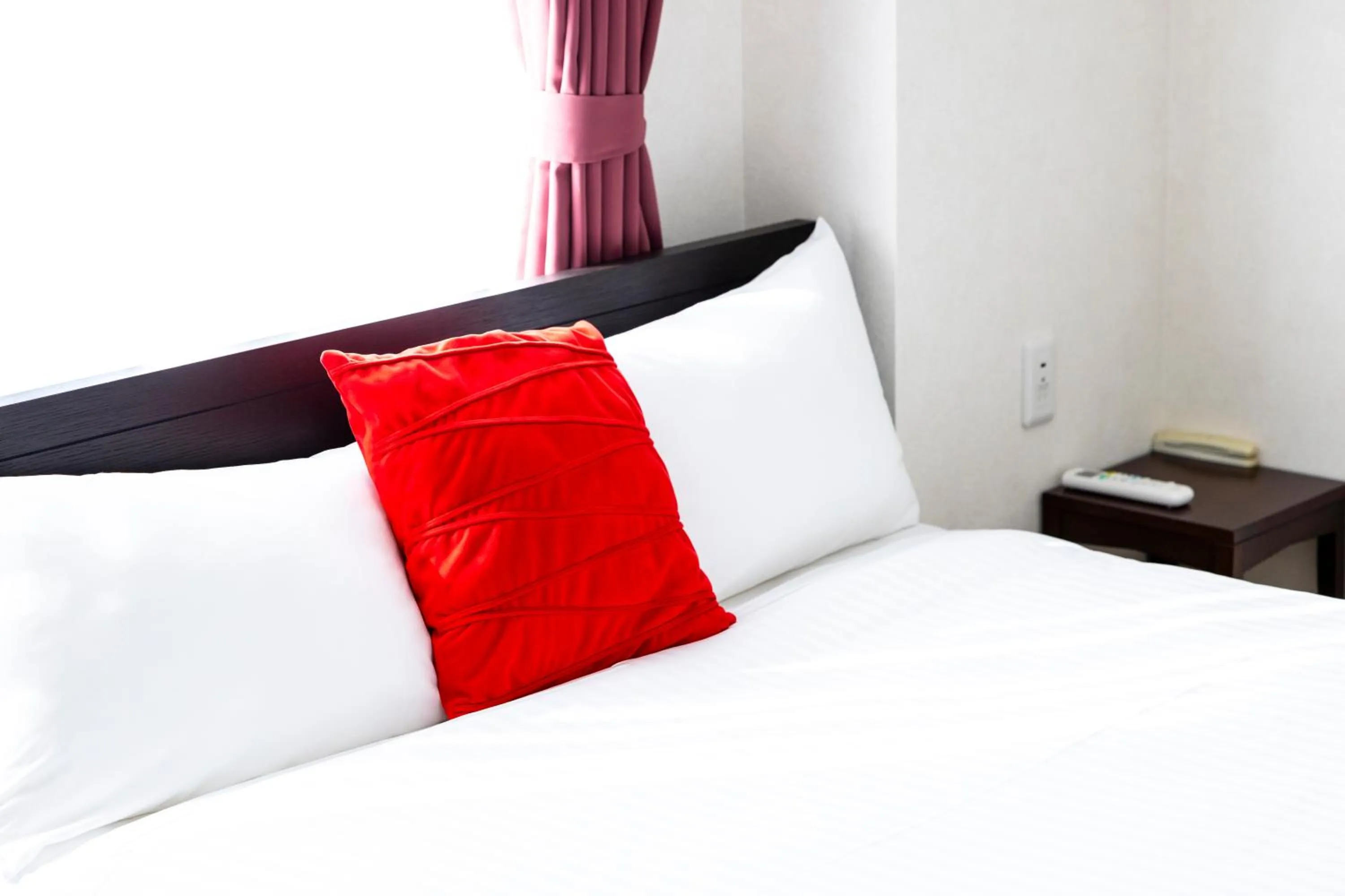 Bed in Riverside Inn Hakata