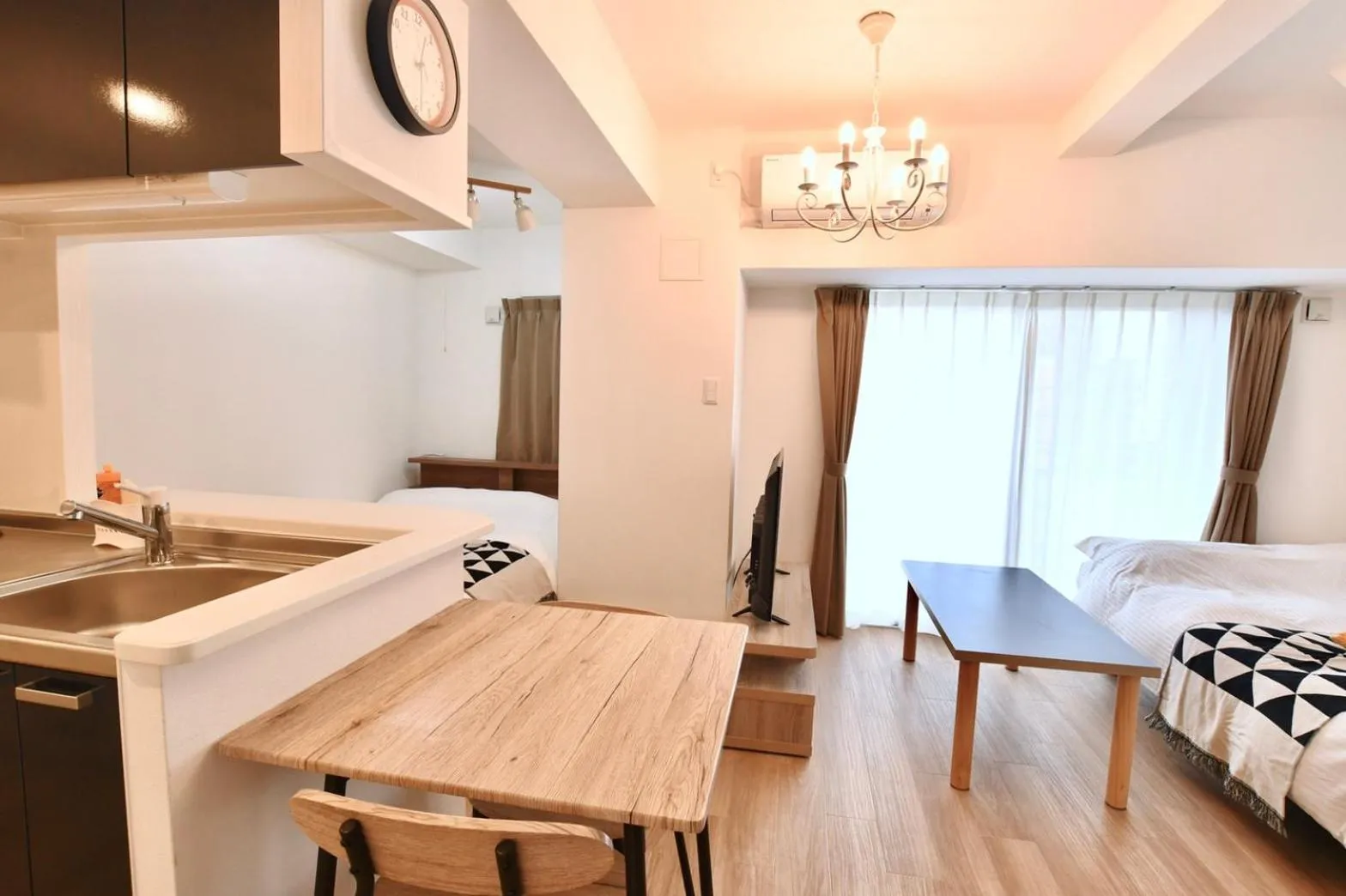 Living room, Bed in Riverside Inn Hakata