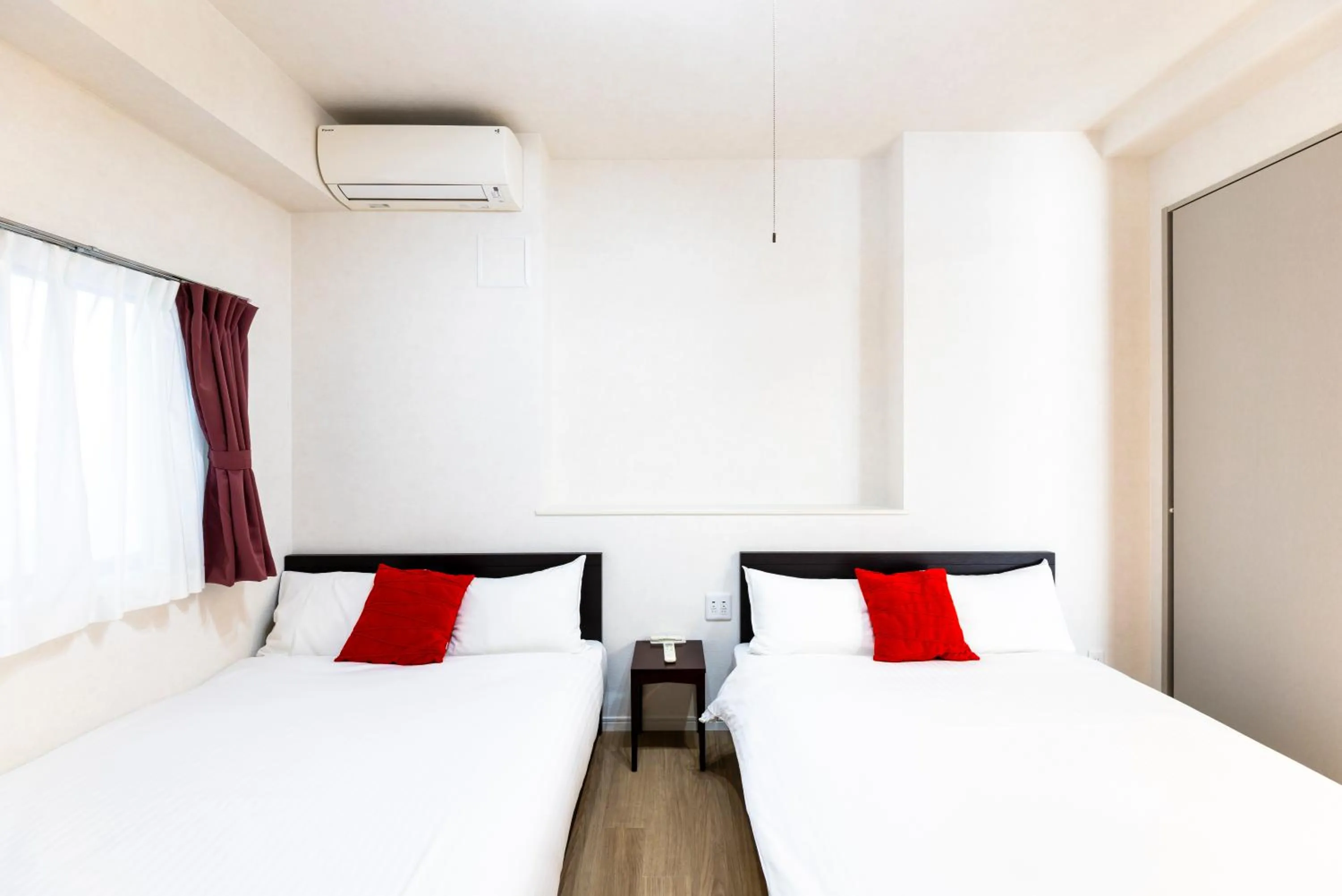 Bed in Riverside Inn Hakata