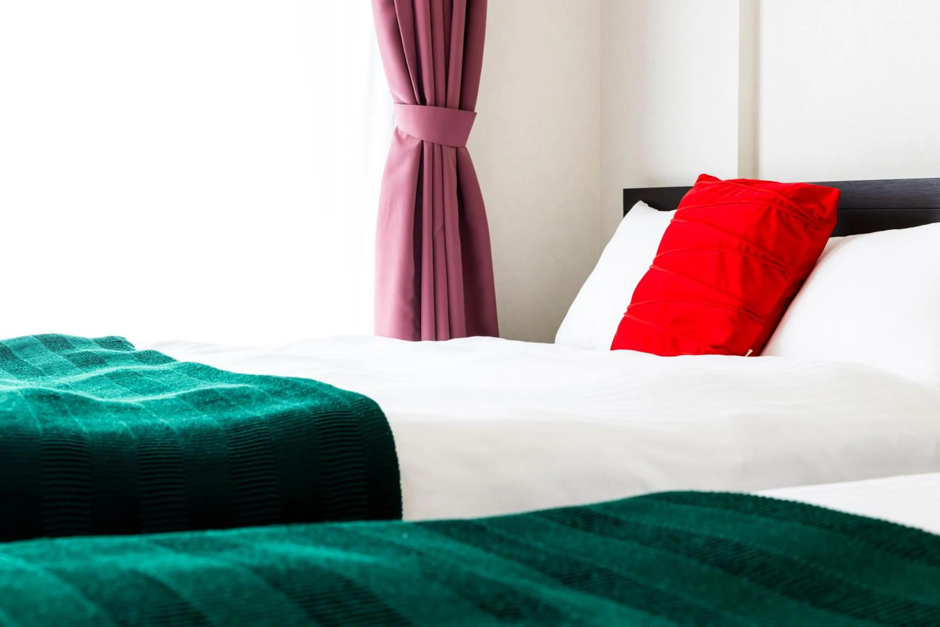 Bed in Riverside Inn Hakata