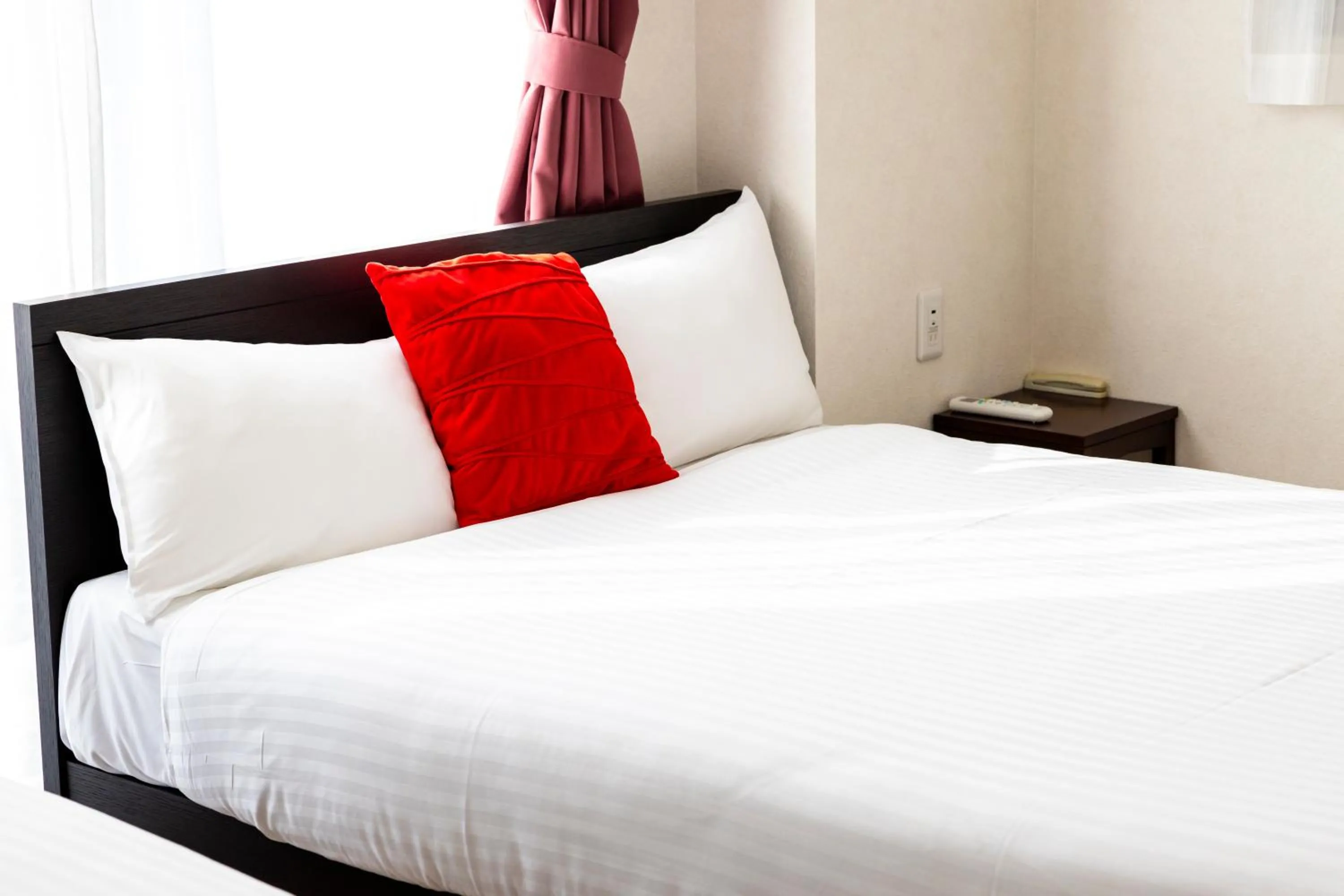 Bed in Riverside Inn Hakata