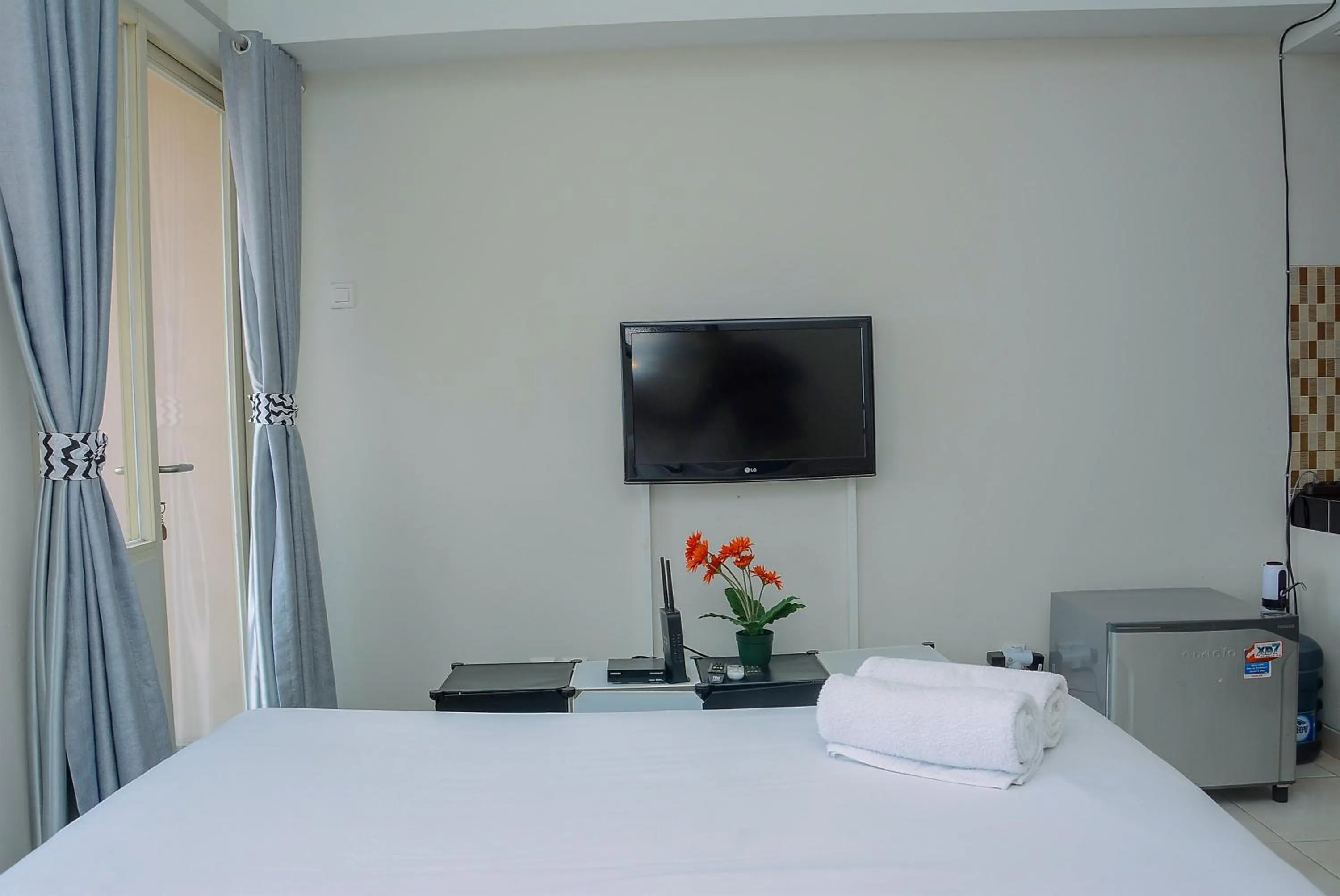 Bed in Elegant Studio Apartment Margonda Residence 5 By Travelio