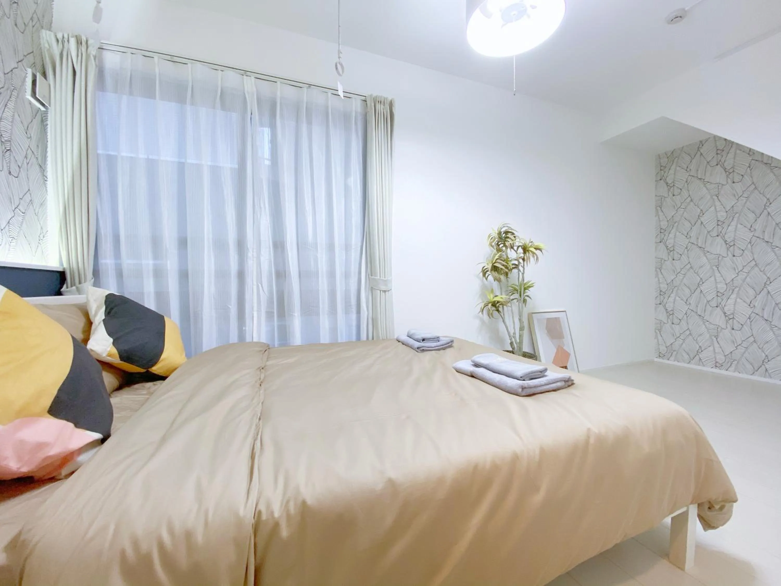 Bed in nestay apartment tokyo ginza