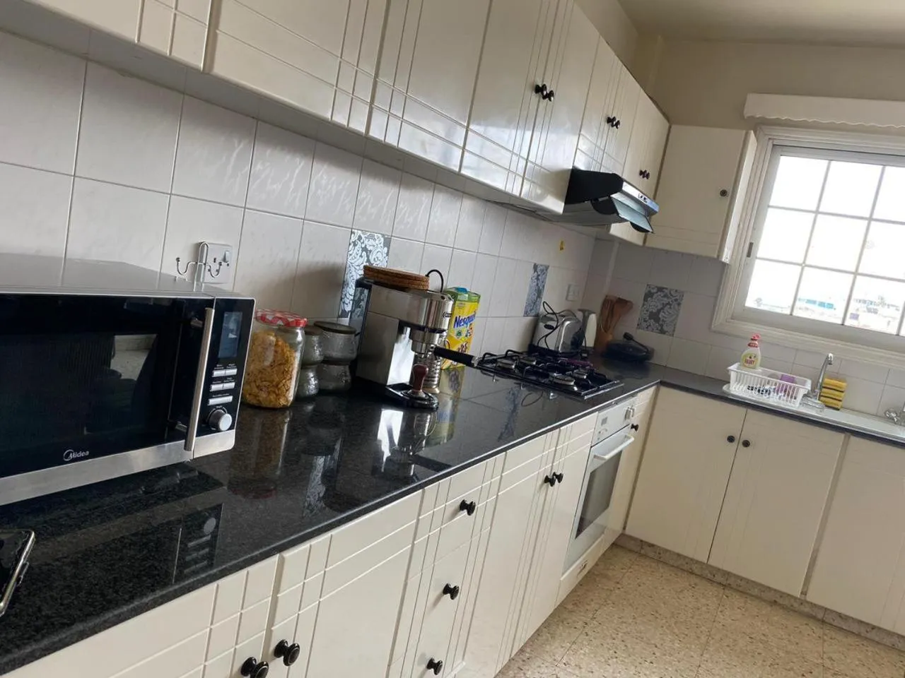 Kitchen or kitchenette in Larnaca Comfort Rooms With Smart TV & Netflix