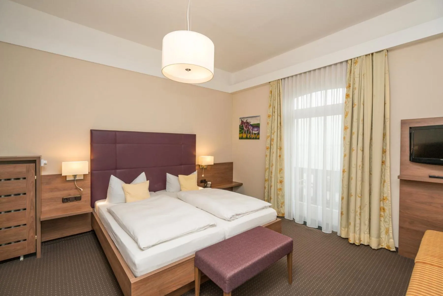 Photo of the whole room, Bed in Seehotel Grauer Bär