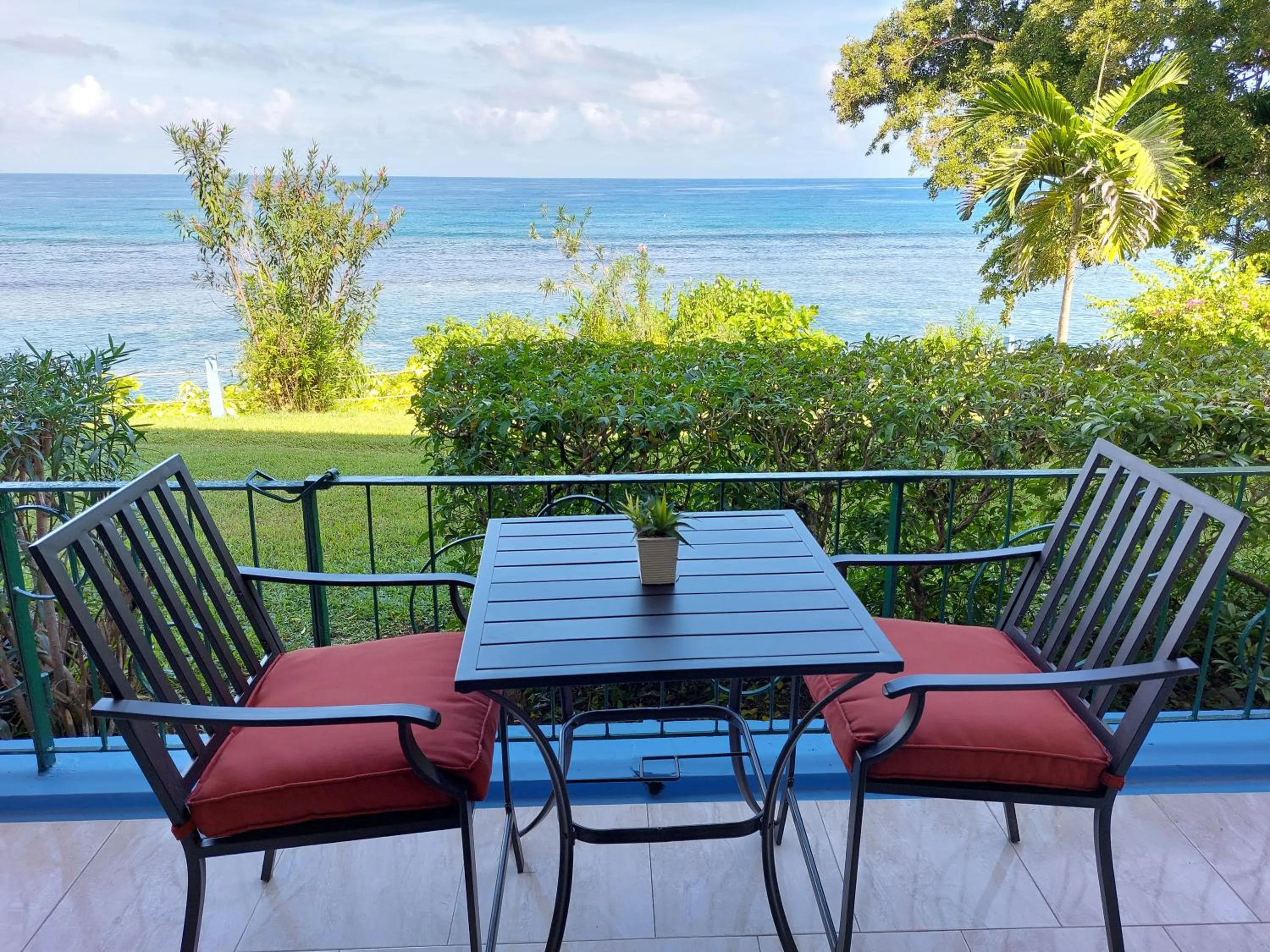 Patio in Contemporary Ocean view 2bed Carib Ocho Rios Condo