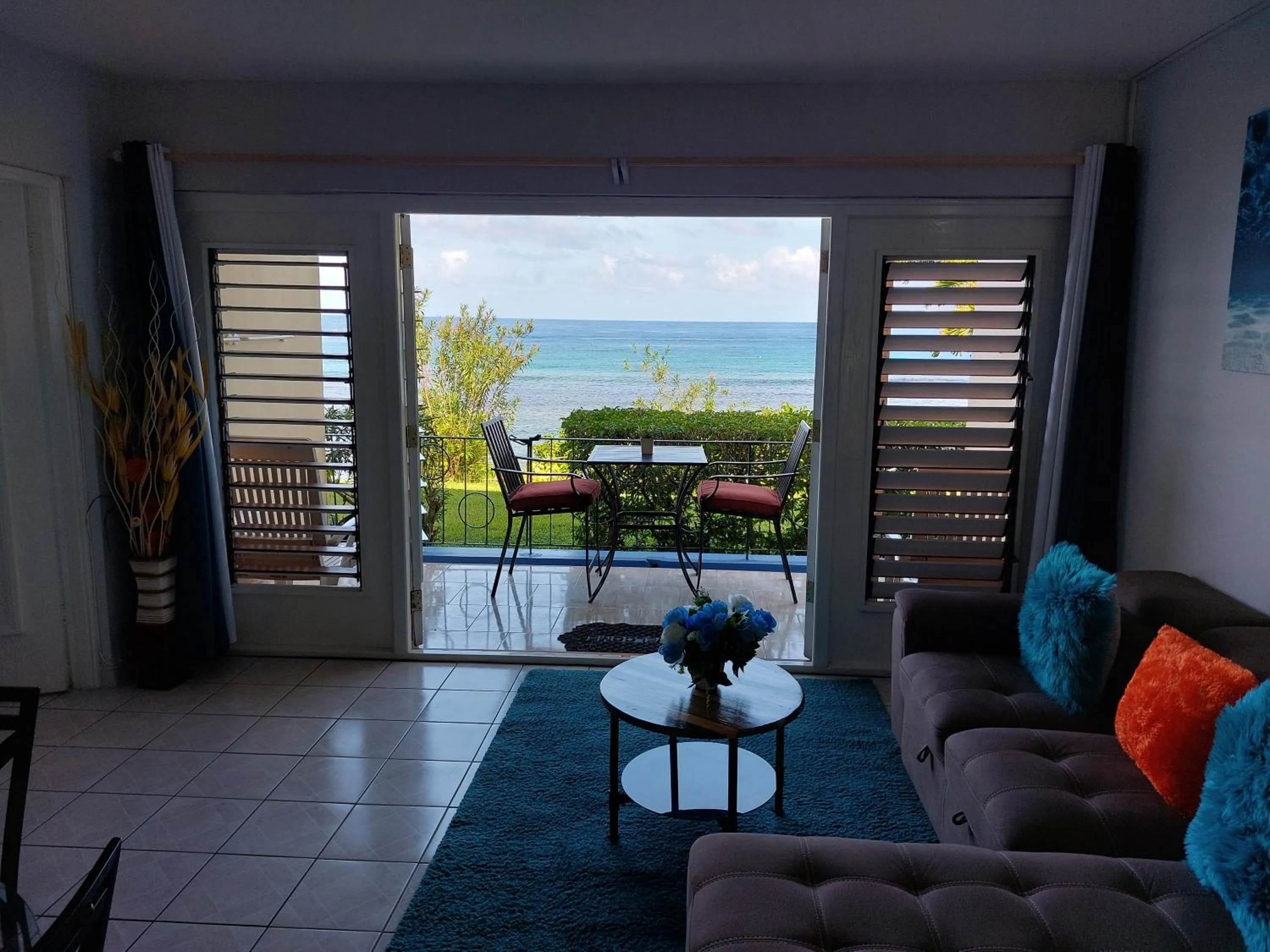 Living room in Contemporary Ocean view 2bed Carib Ocho Rios Condo