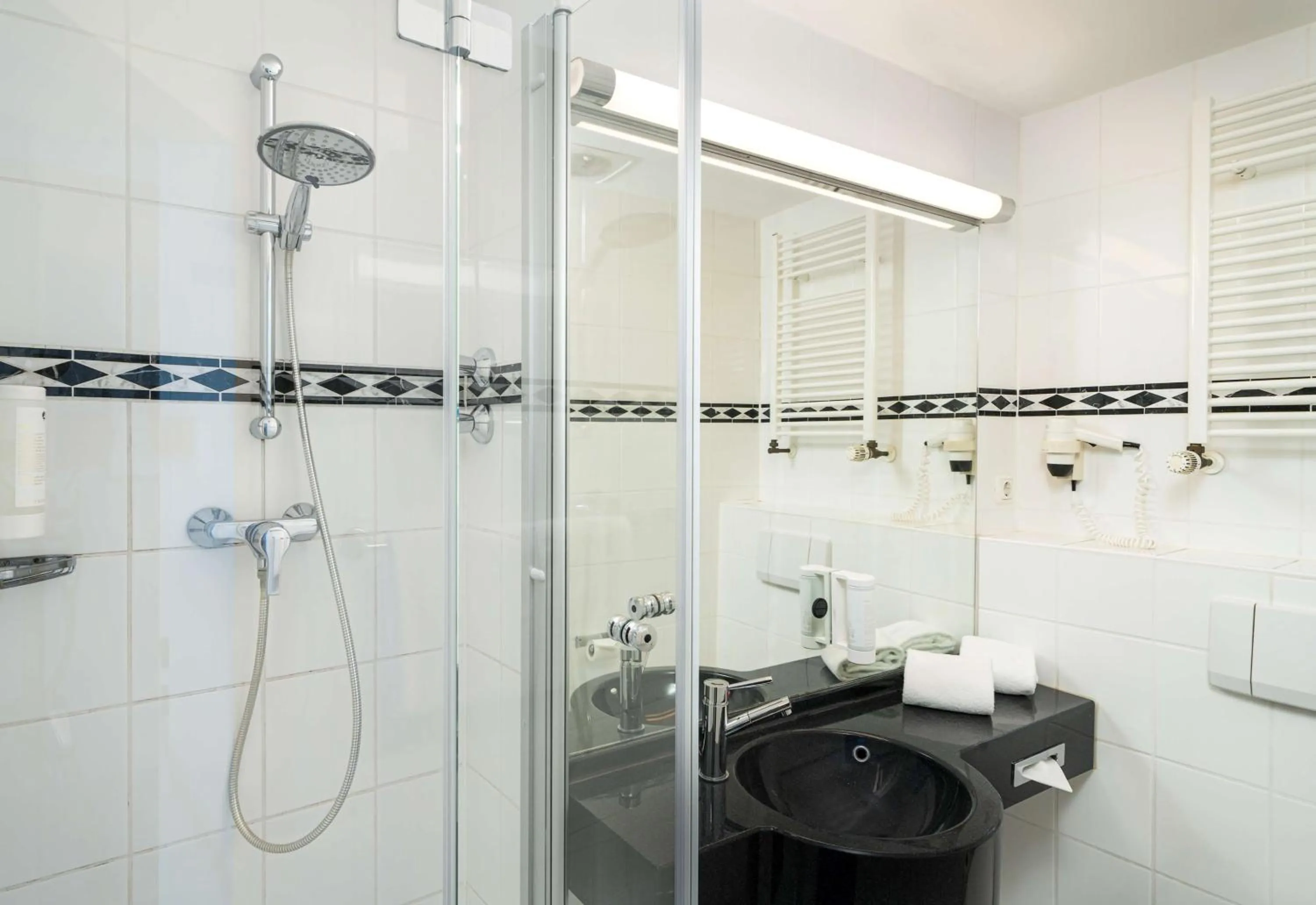 Bathroom in elaya hotel hannover city