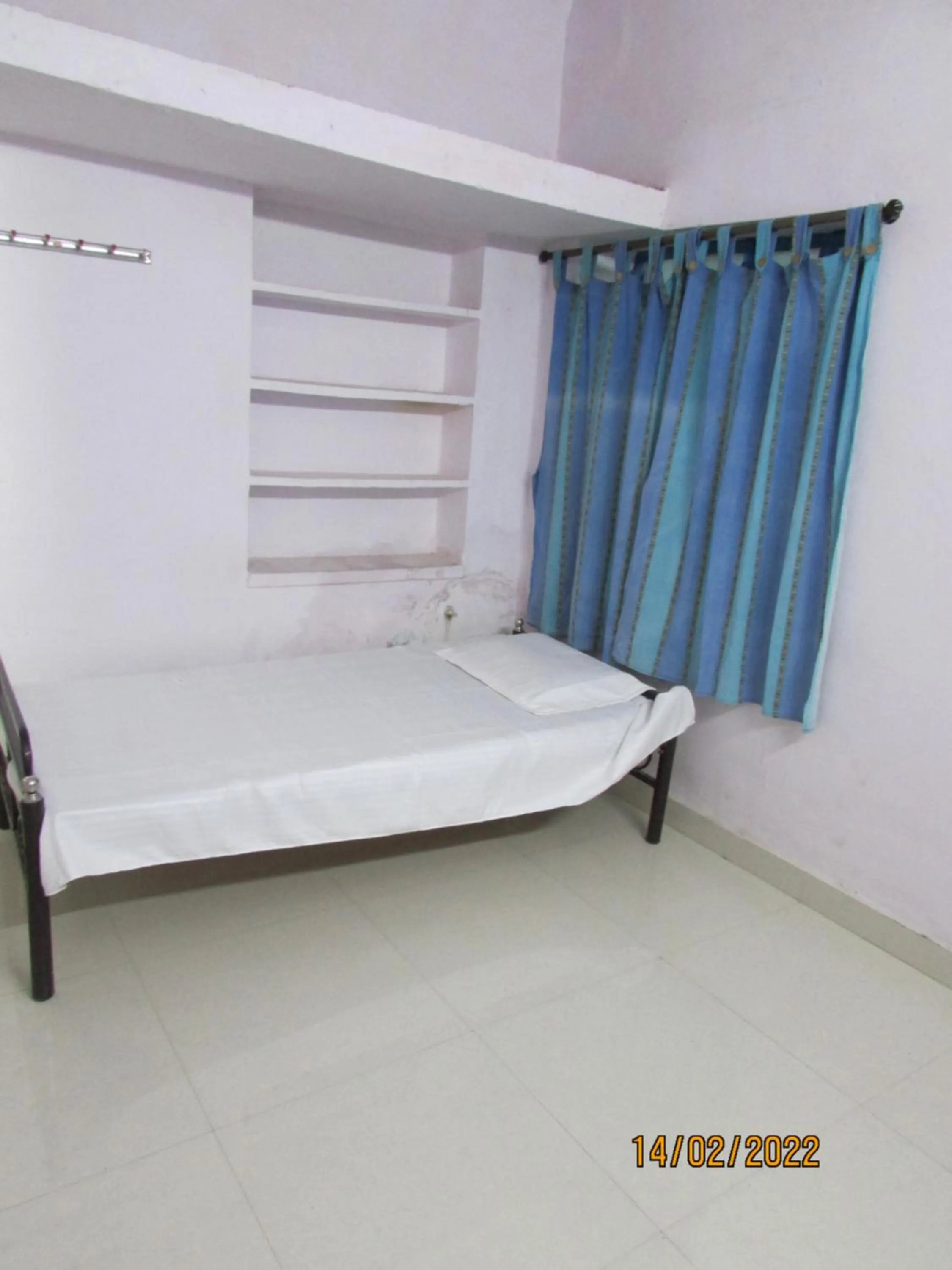 Bed in Ashish Guest House, Goverdhan Vilas