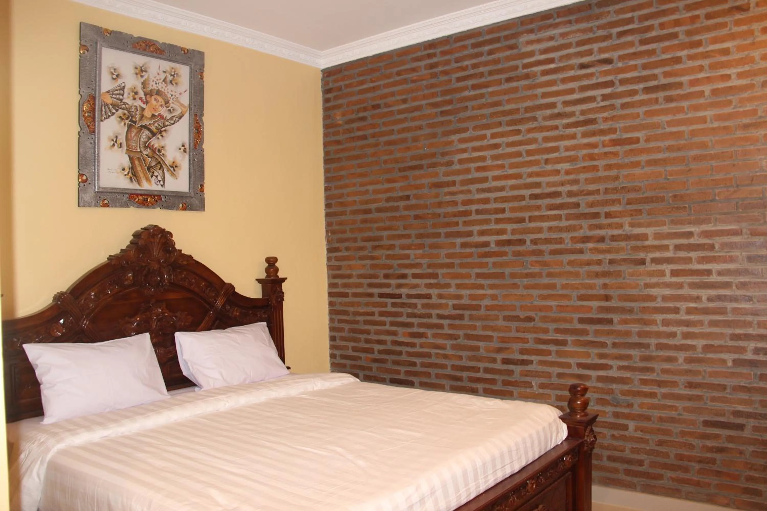 Bed in The Garuda Homestay Sanur