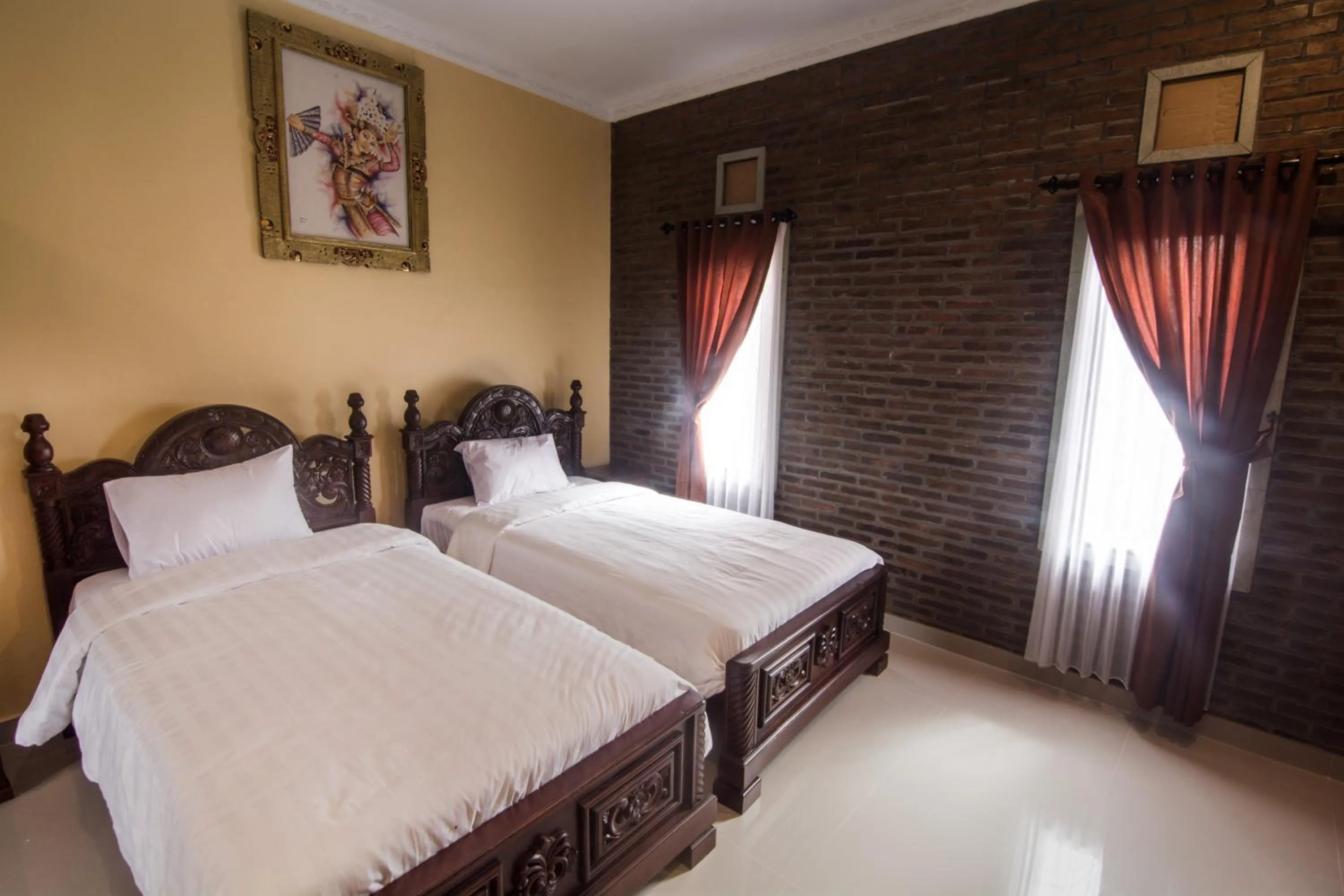 Bed in The Garuda Homestay Sanur