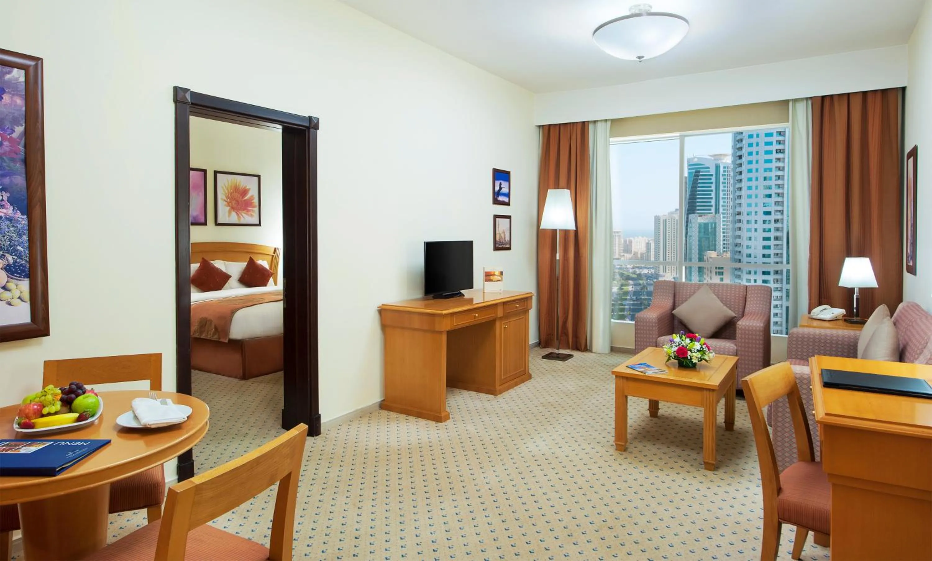 Living room, Bed in Golden Tulip Sharjah