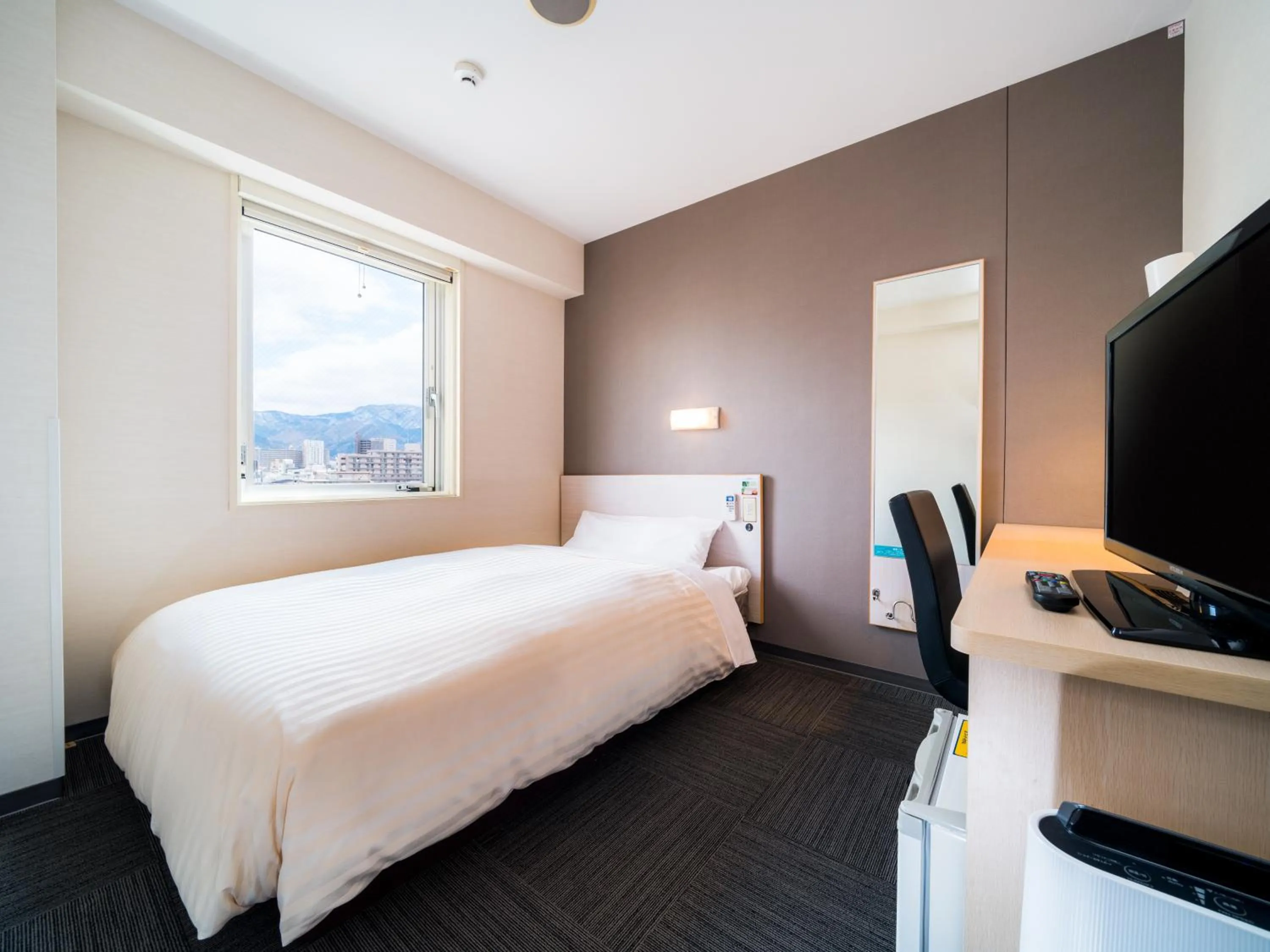 Bed in Super Hotel Yamagataeki Nishiguchi Hot Spring