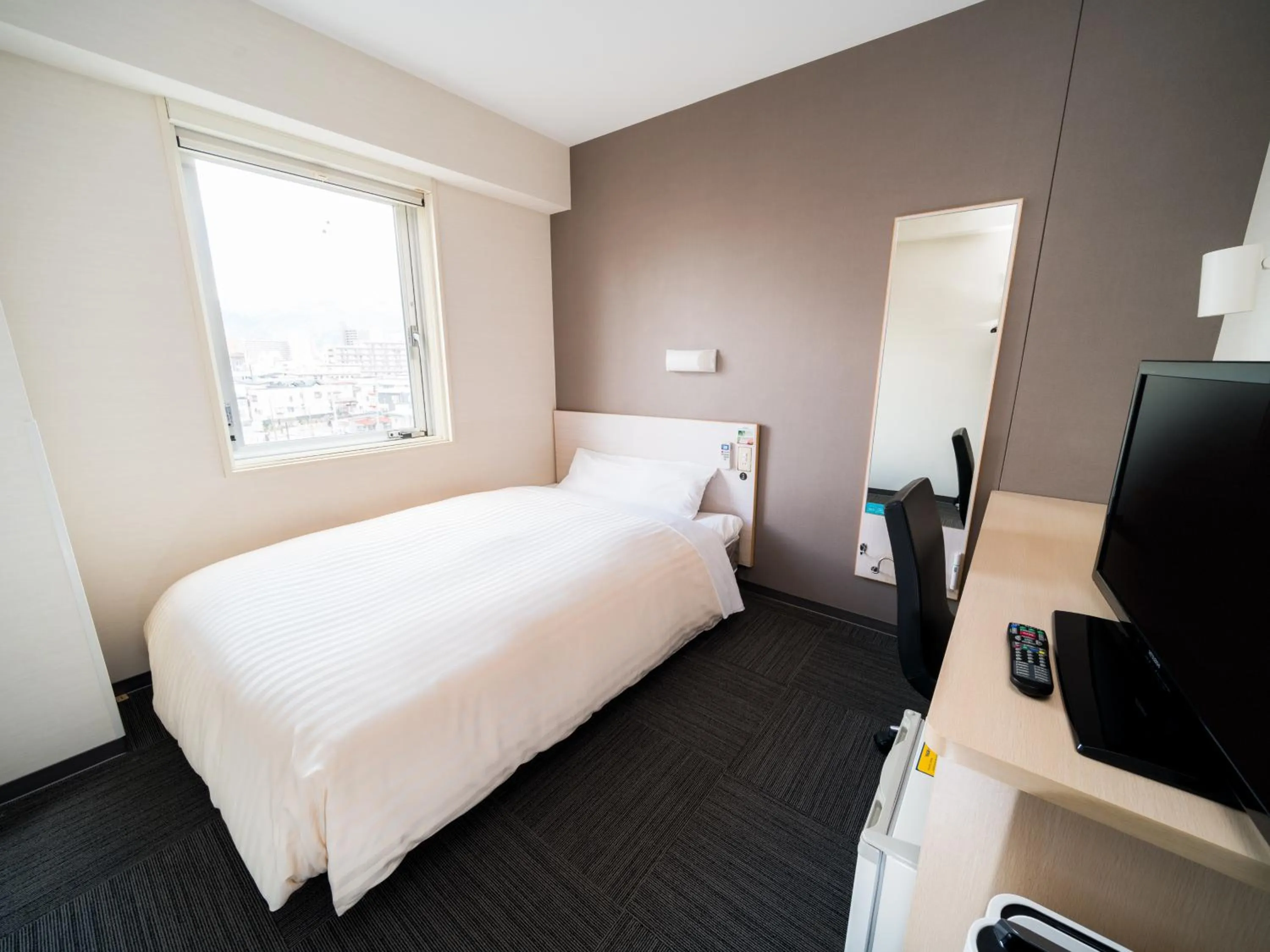 Bed in Super Hotel Yamagataeki Nishiguchi Hot Spring