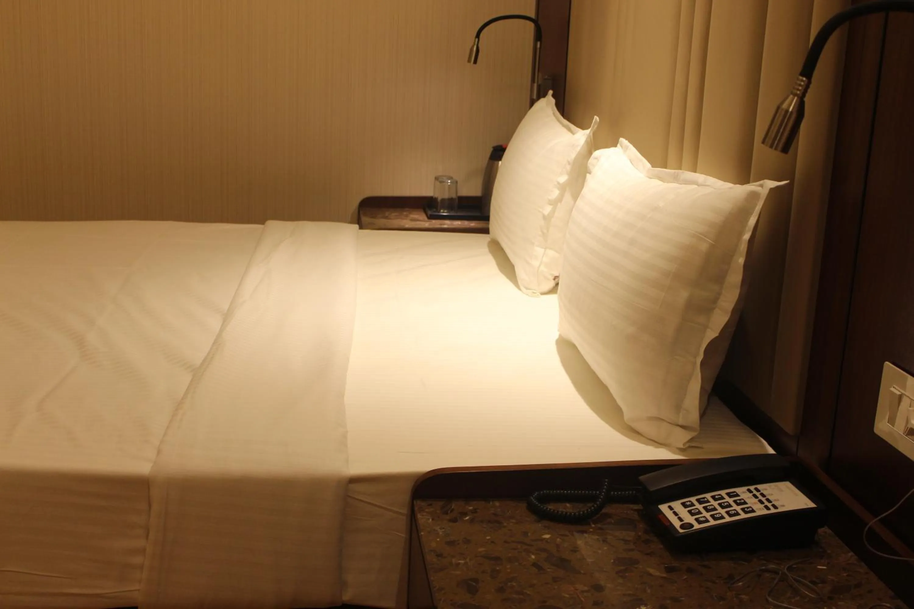 Bed in HOTEL RAJHANS ABHINANDAN