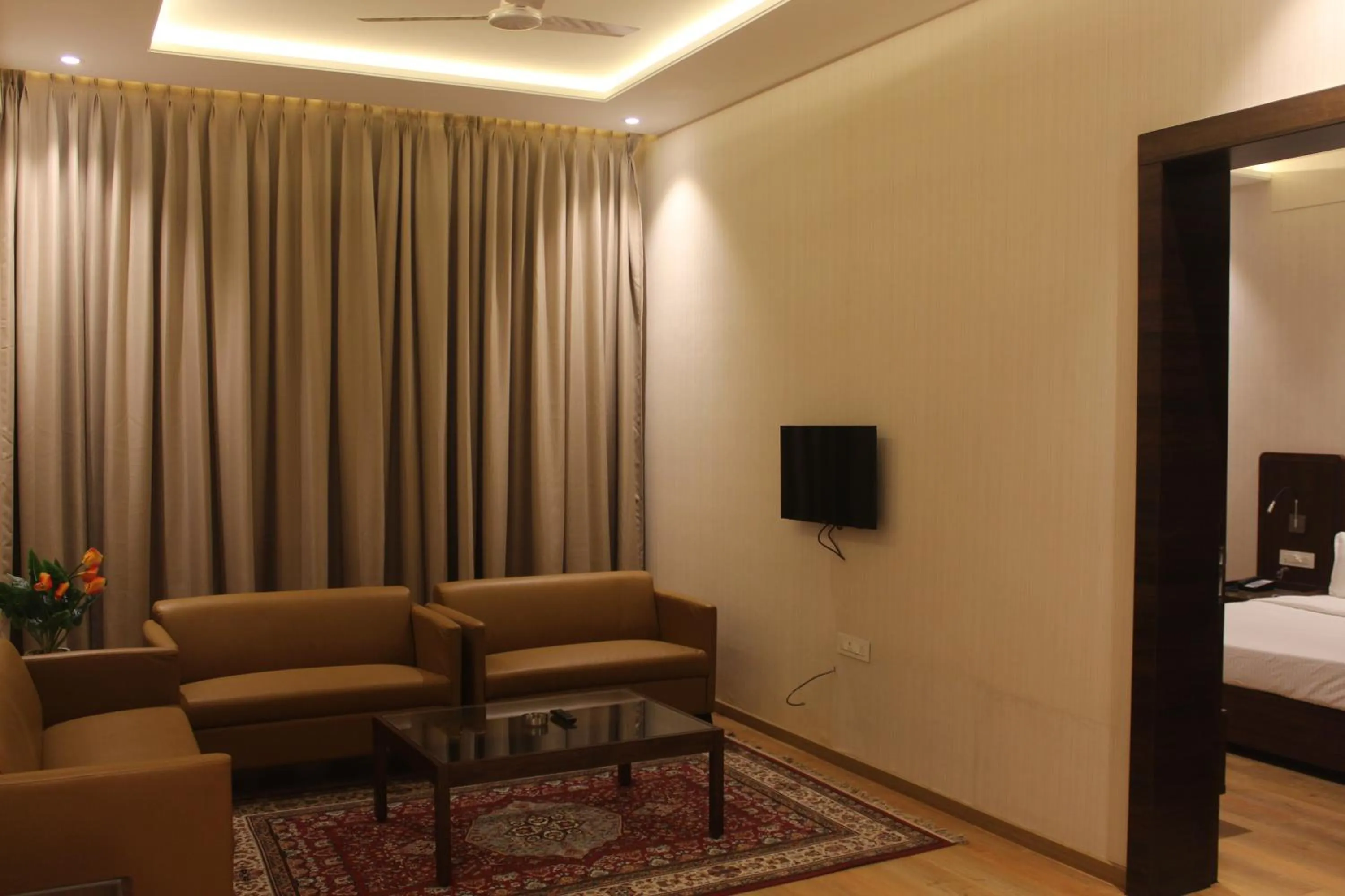 Seating area, Bed in HOTEL RAJHANS ABHINANDAN