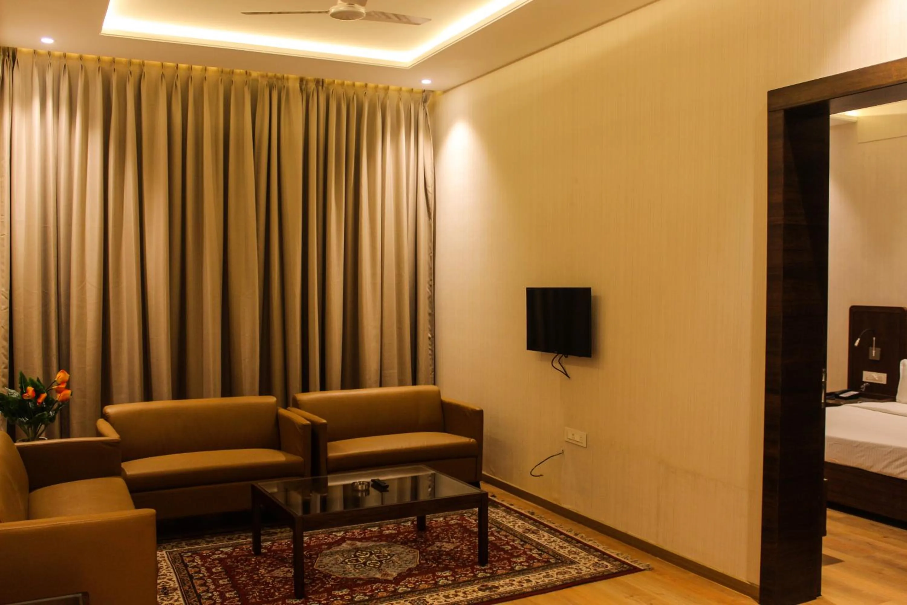 Living room, Bed in HOTEL RAJHANS ABHINANDAN