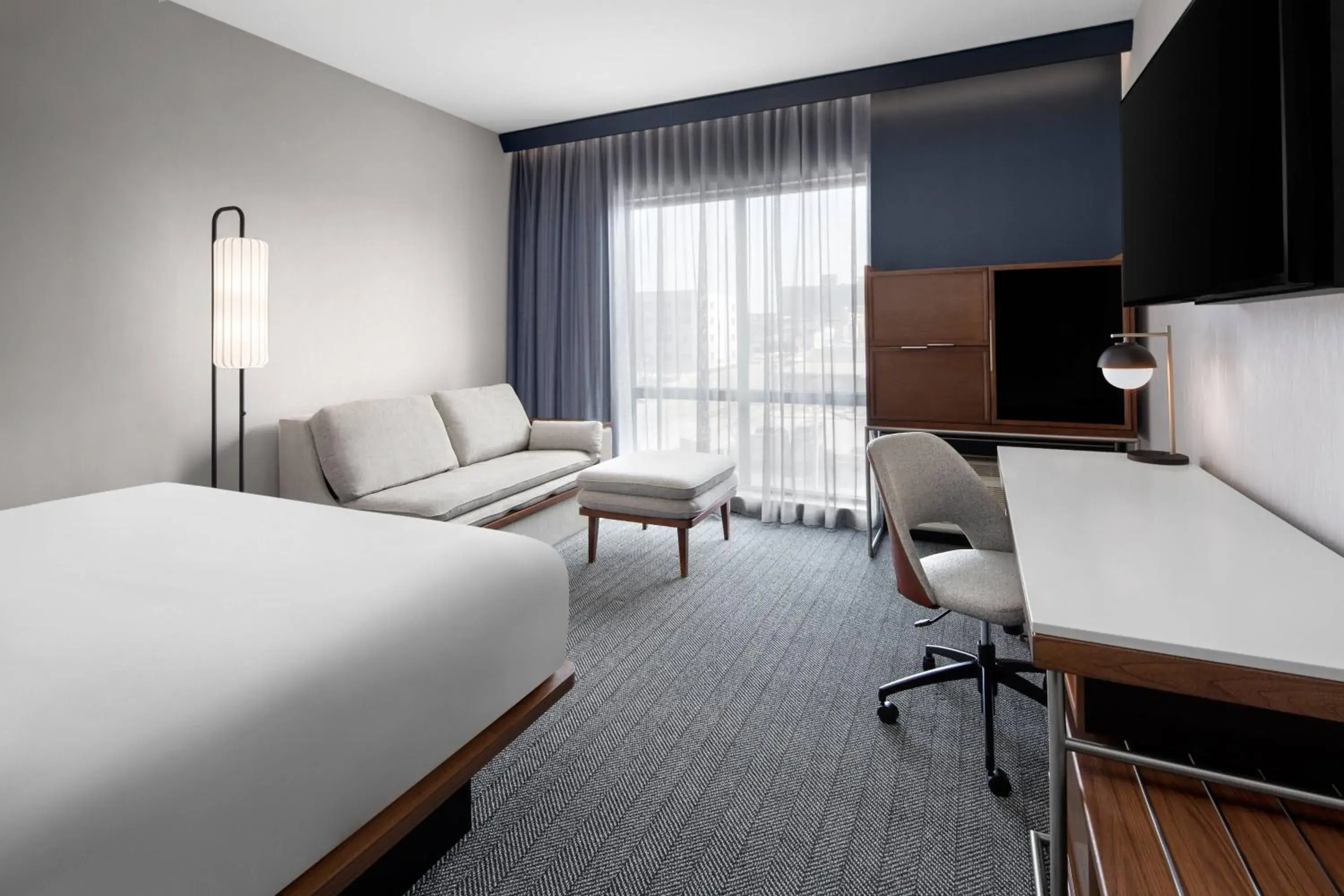 King Room with Sofa Bed and Roll-in Shower - Mobility and Hearing Accessible in Courtyard by Marriott Lansing Downtown King Room with Sofa Bed and Roll-in Shower - Mobility and Hearing Accessible in Courtyard by Marriott Lansing Downtown