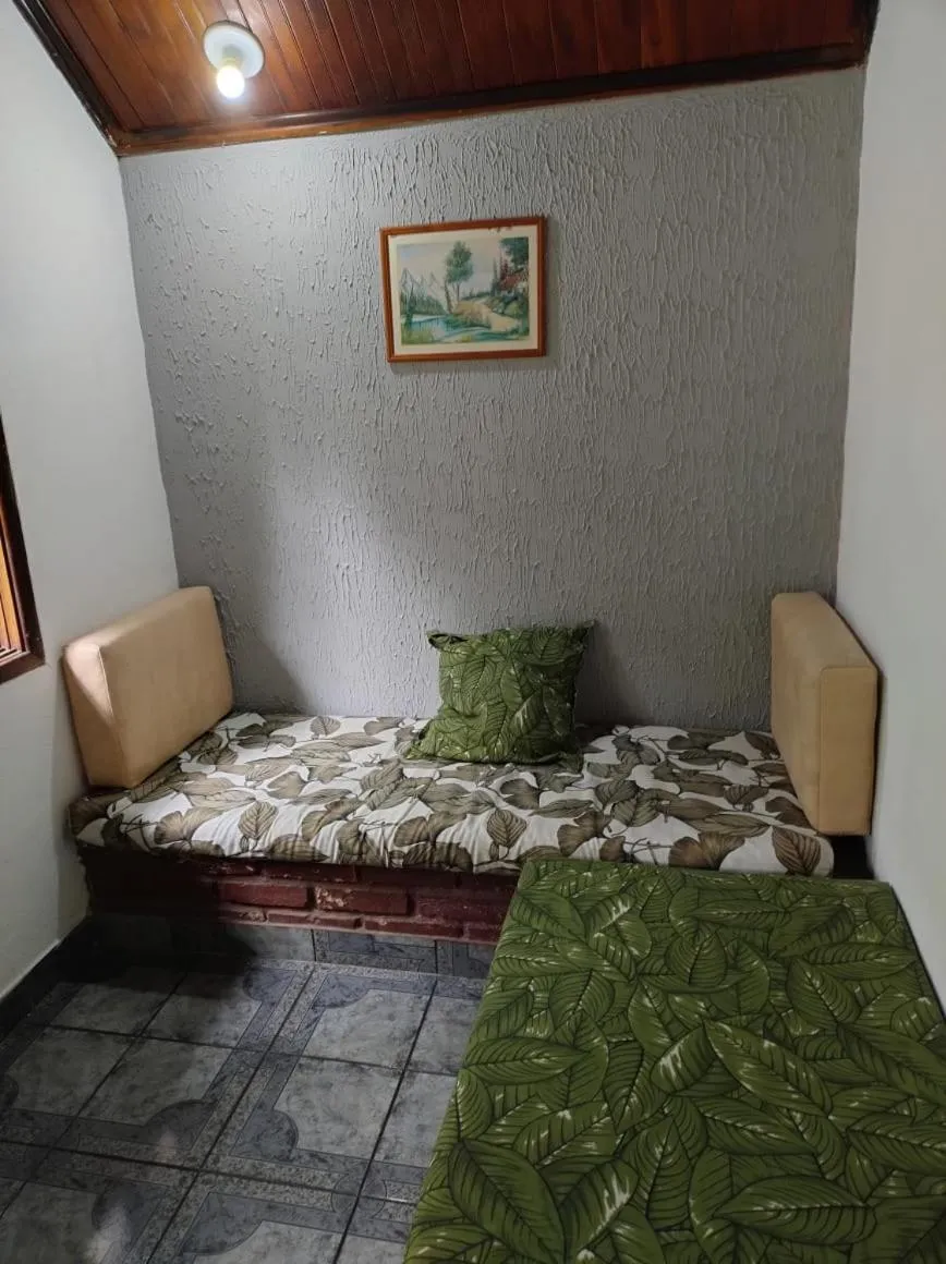 Bed in Pousada Nova Conquista