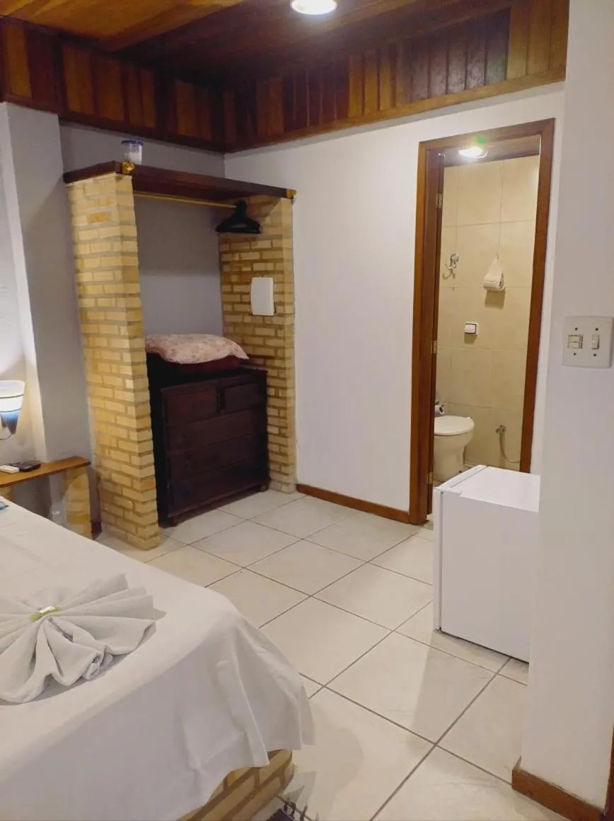 Bed in Pousada Nova Conquista