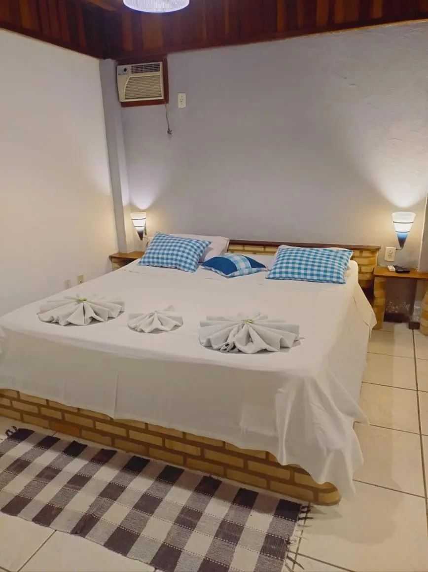 Bed in Pousada Nova Conquista