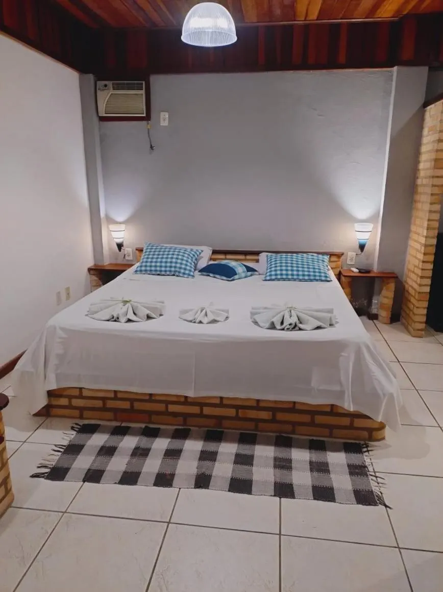 Bed in Pousada Nova Conquista